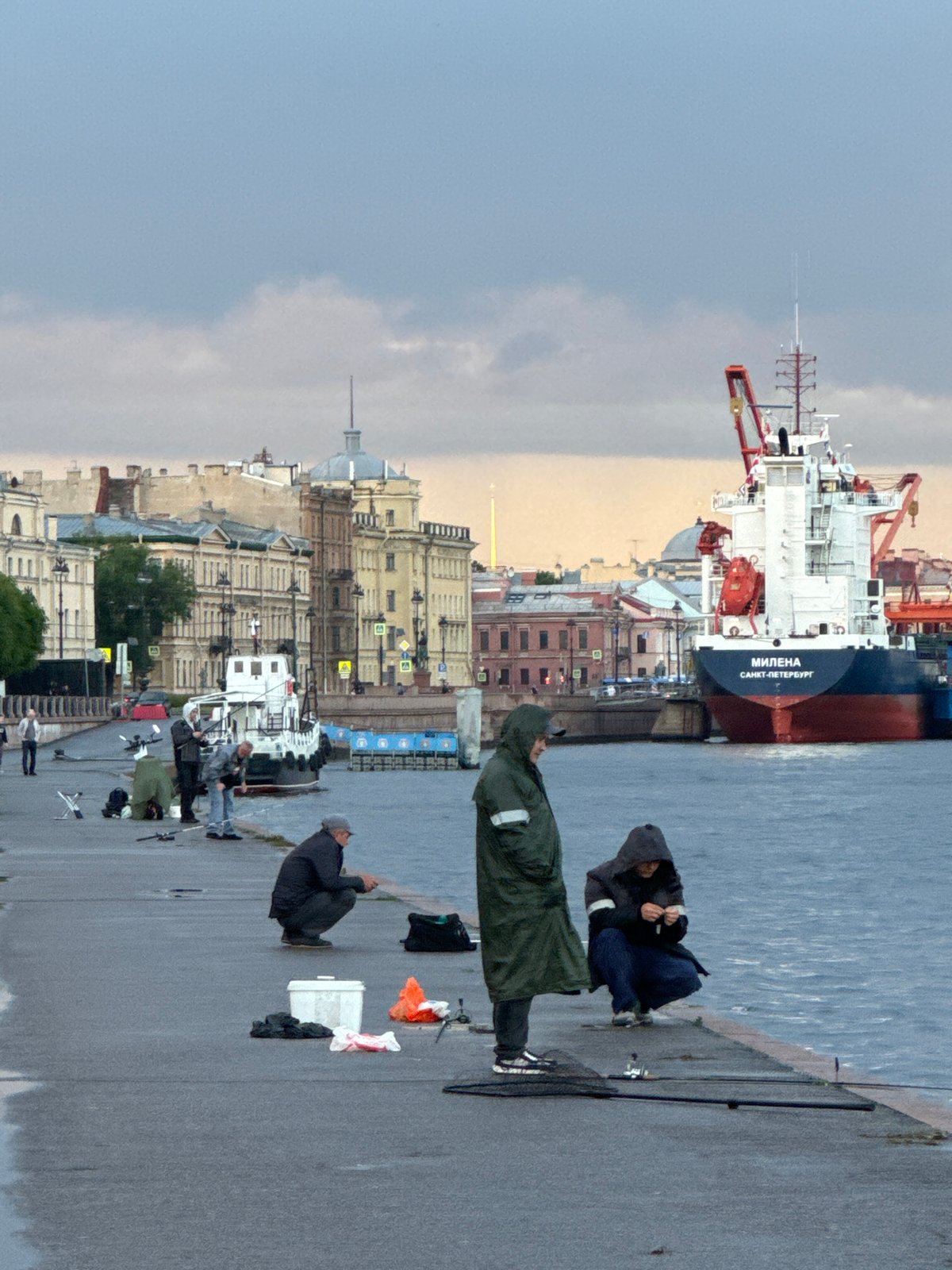 Evening fishing and harbor scenes along Saint Petersburg's Neva embankment