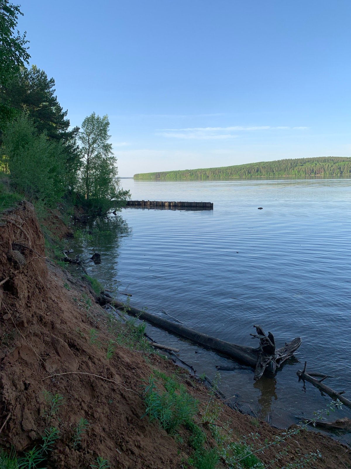 Family enjoys afternoon outing by Kama River in Chaikovsky