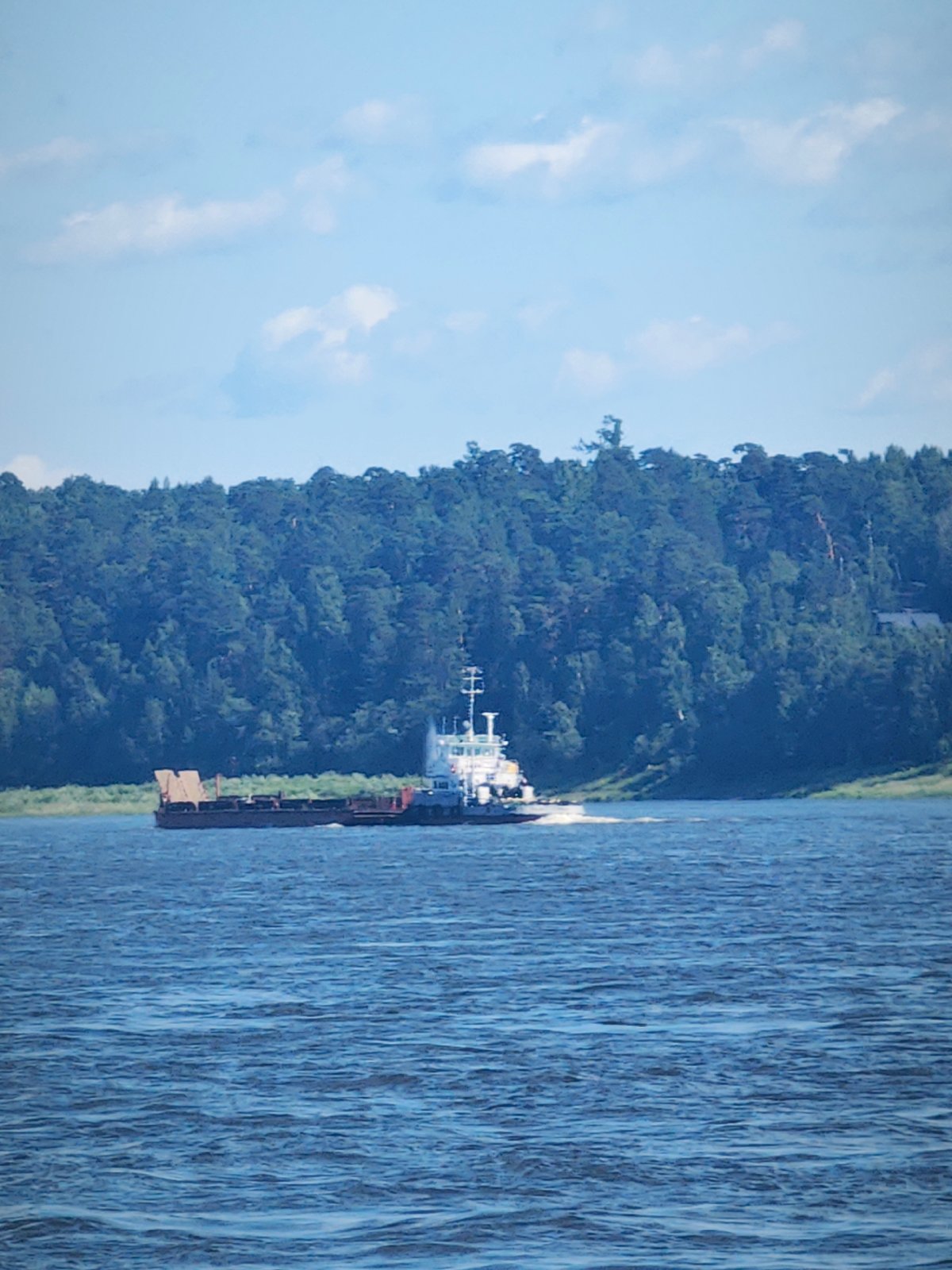Tugboats, barges, and cranes on the Angara River