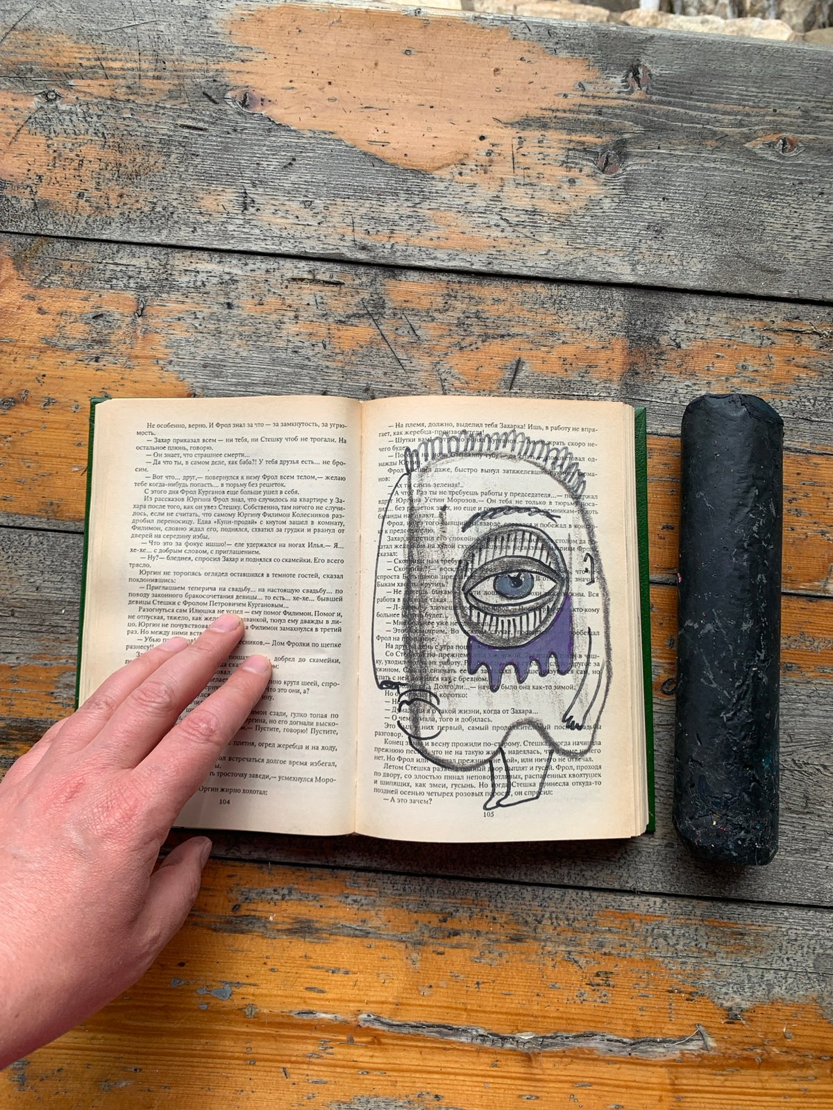 Charcoal drawings made onto a Russian book's pages in Sergeevo