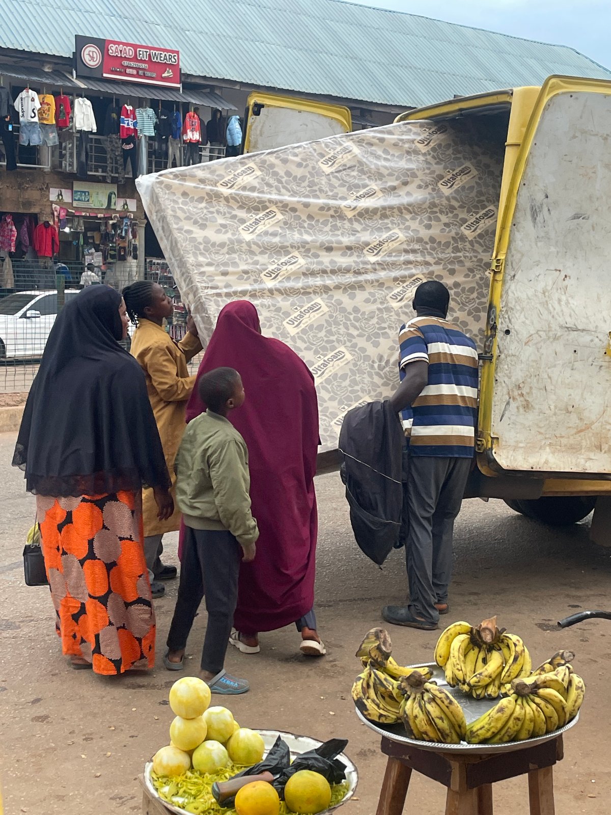 Bukuru street market buzzing with vendors and foot traffic