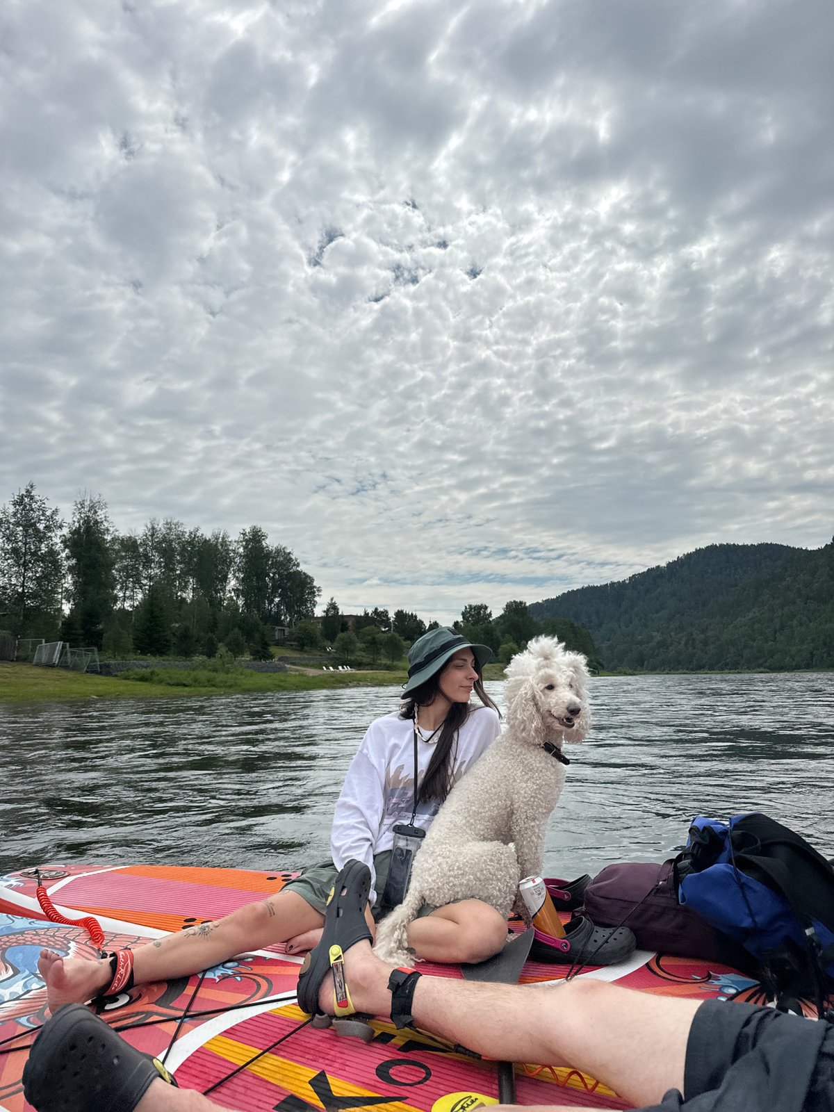 Laid-back paddleboard session on a cloudy Russian river