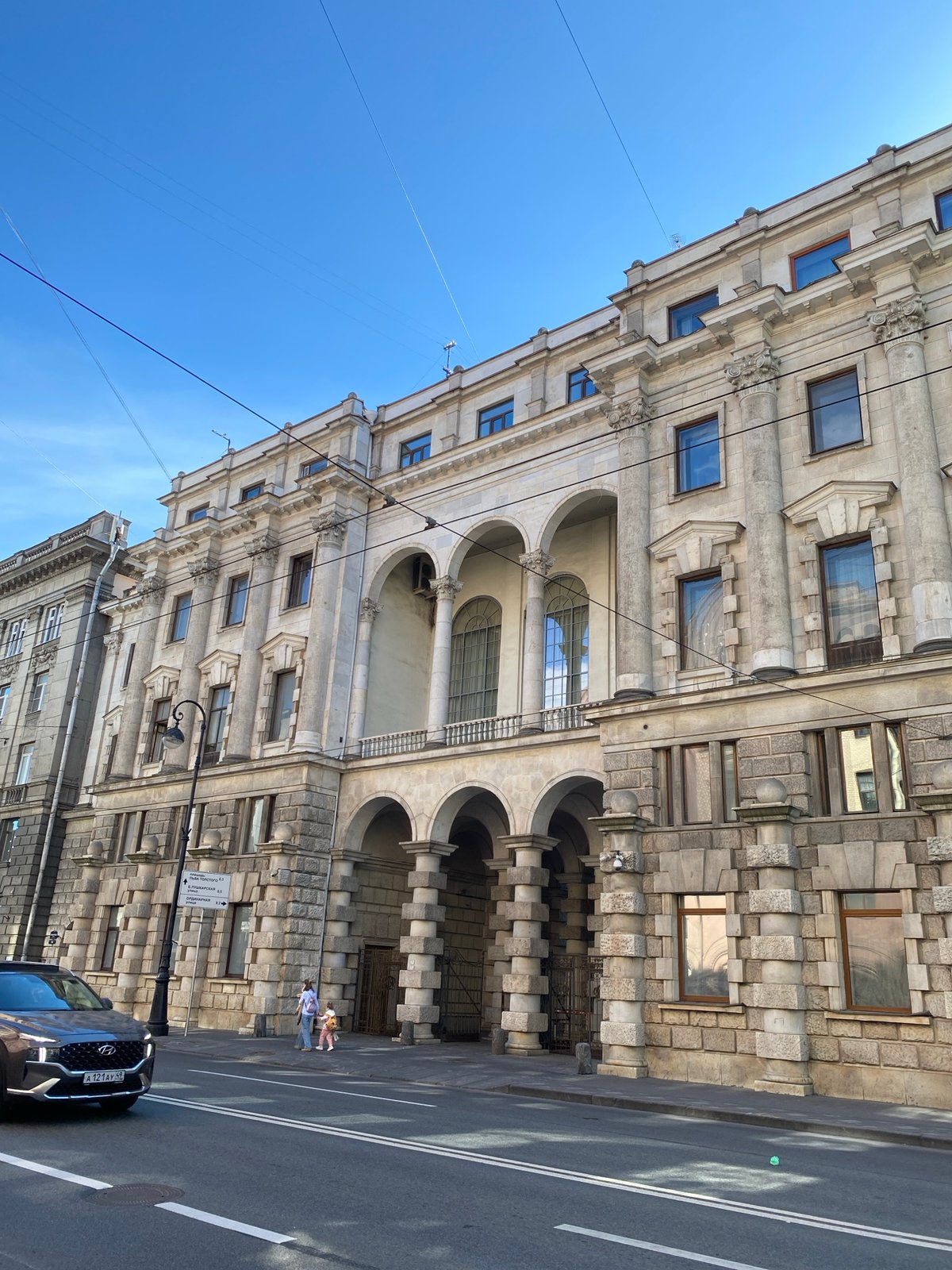 Sunny afternoon stroll captured along Saint Petersburg canal district
