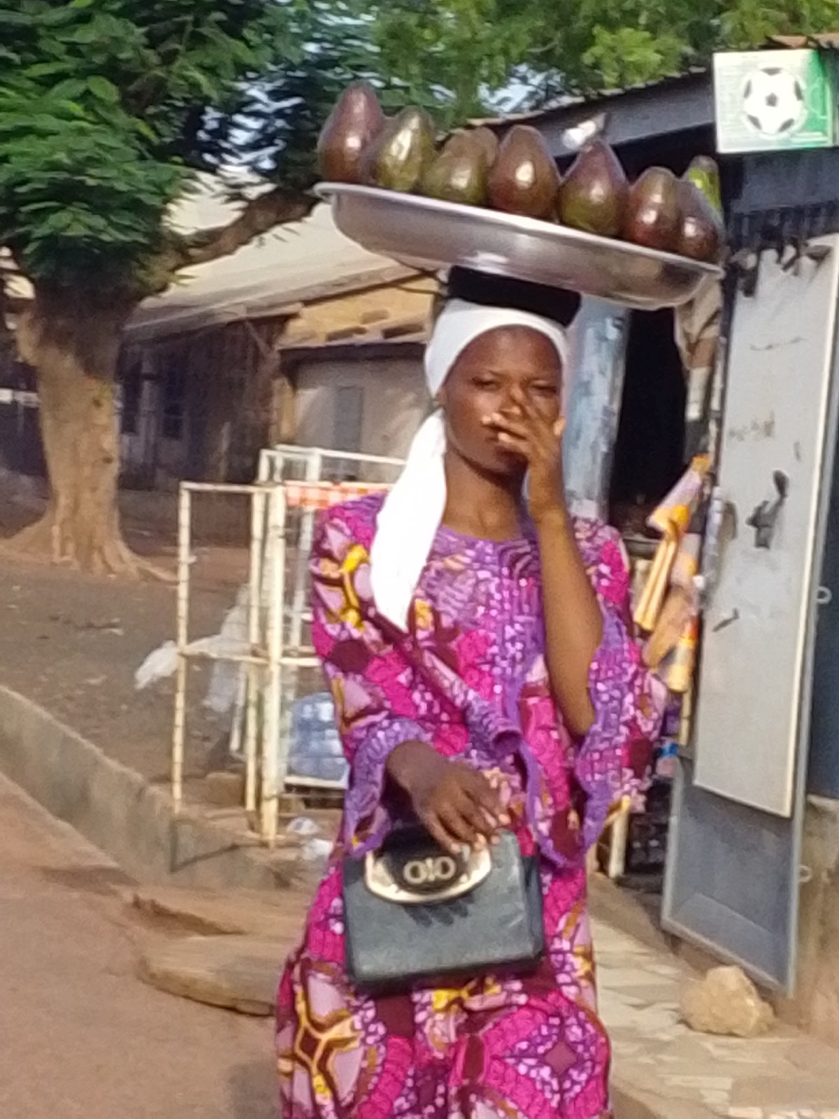 Street vendors sell avocados, sunglasses in Tamale Ghana