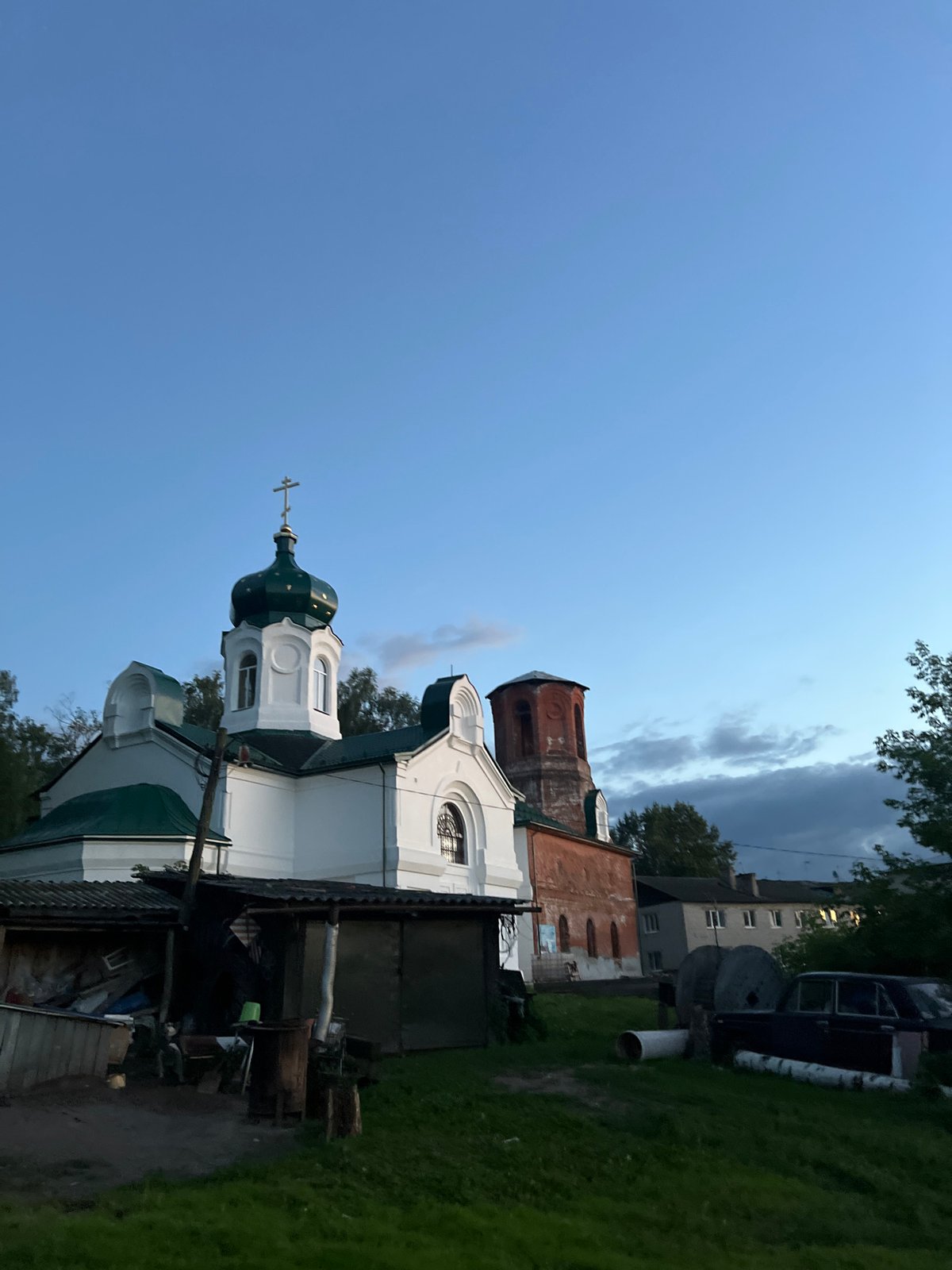 Dusk settles over a quiet rural yard in Afanasyevo