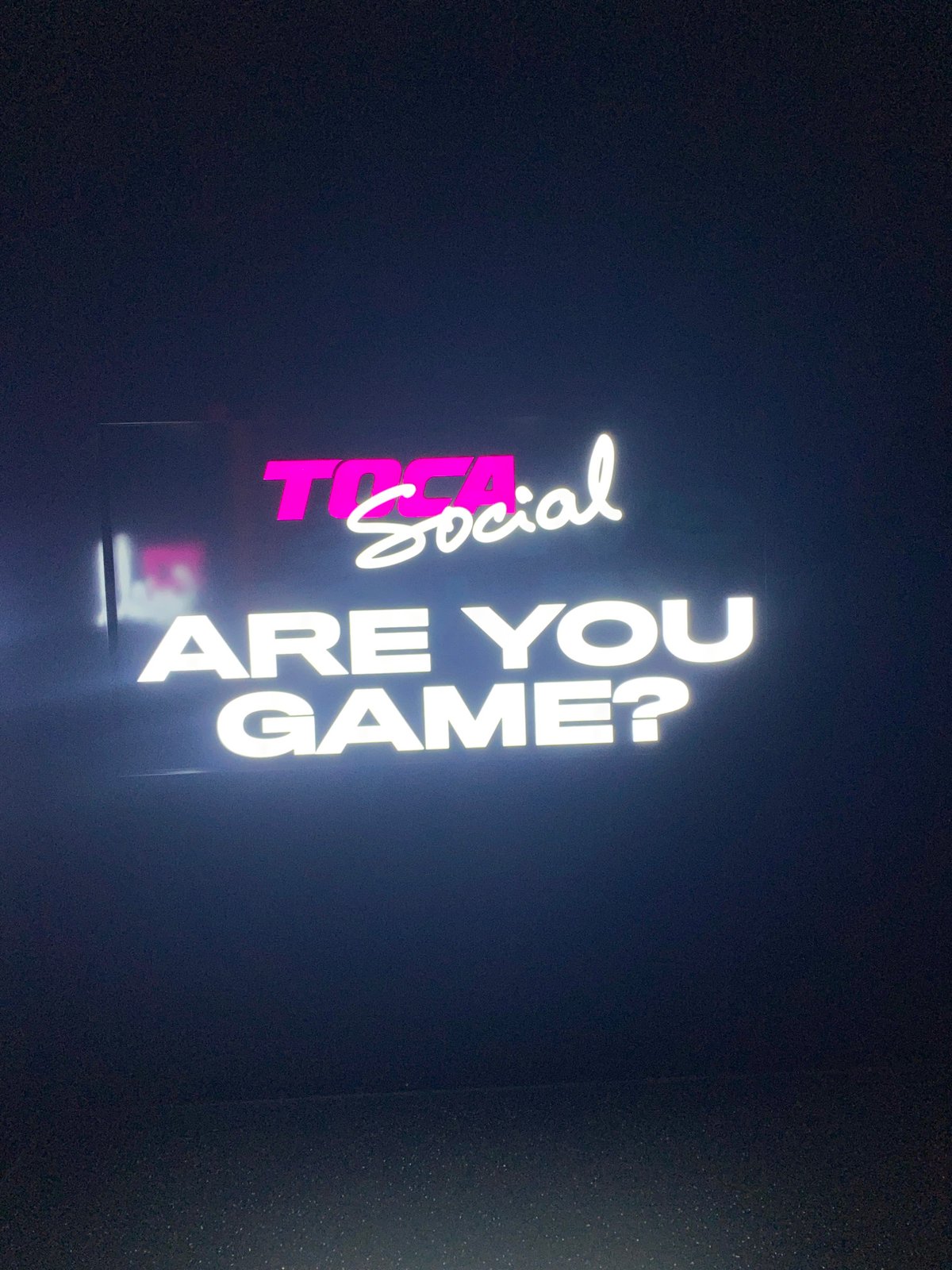 Woman plays interactive games at TOCA Social venue in London