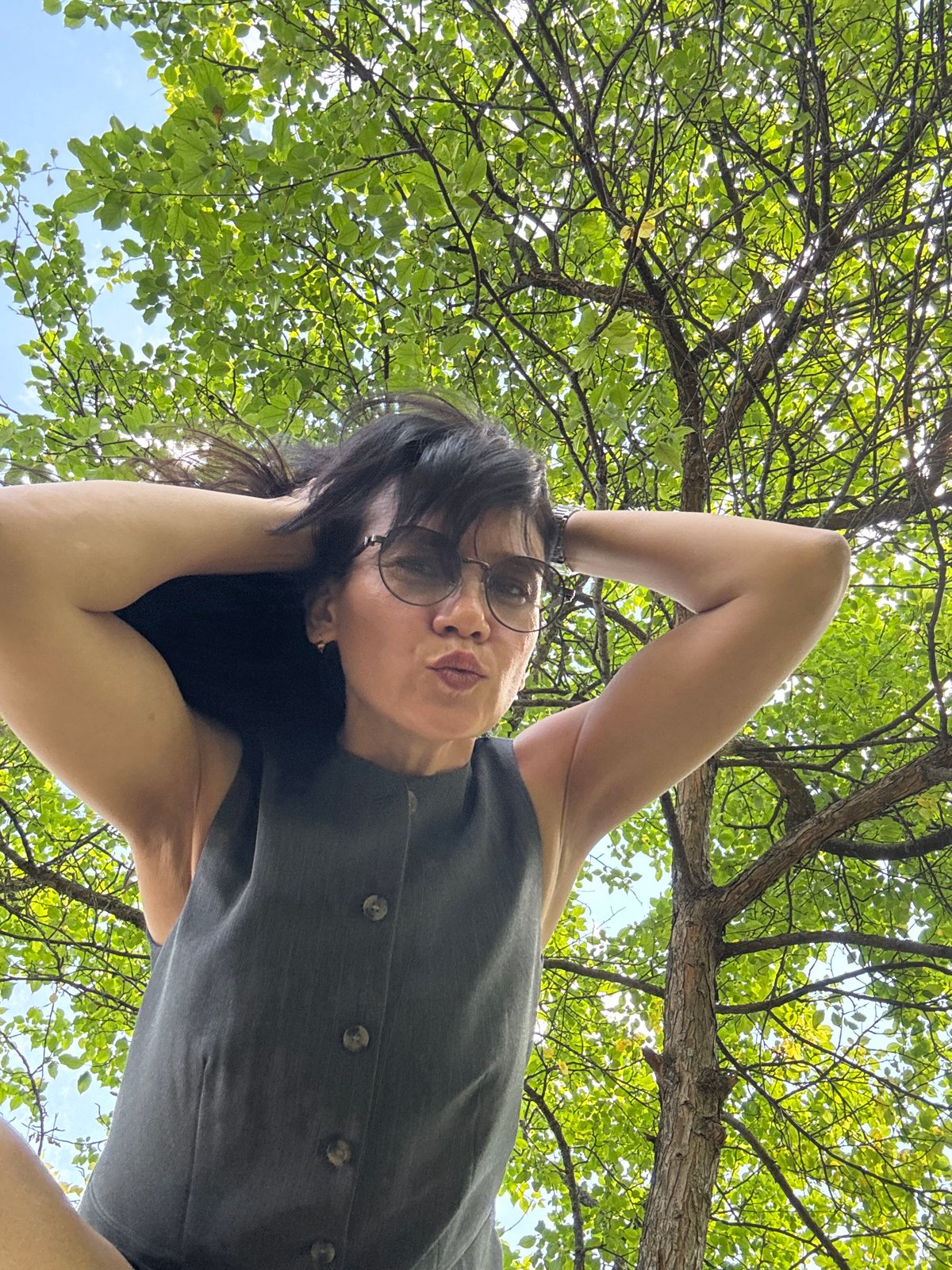 Summer morning photo session across a Chaikovsky park and courtyard