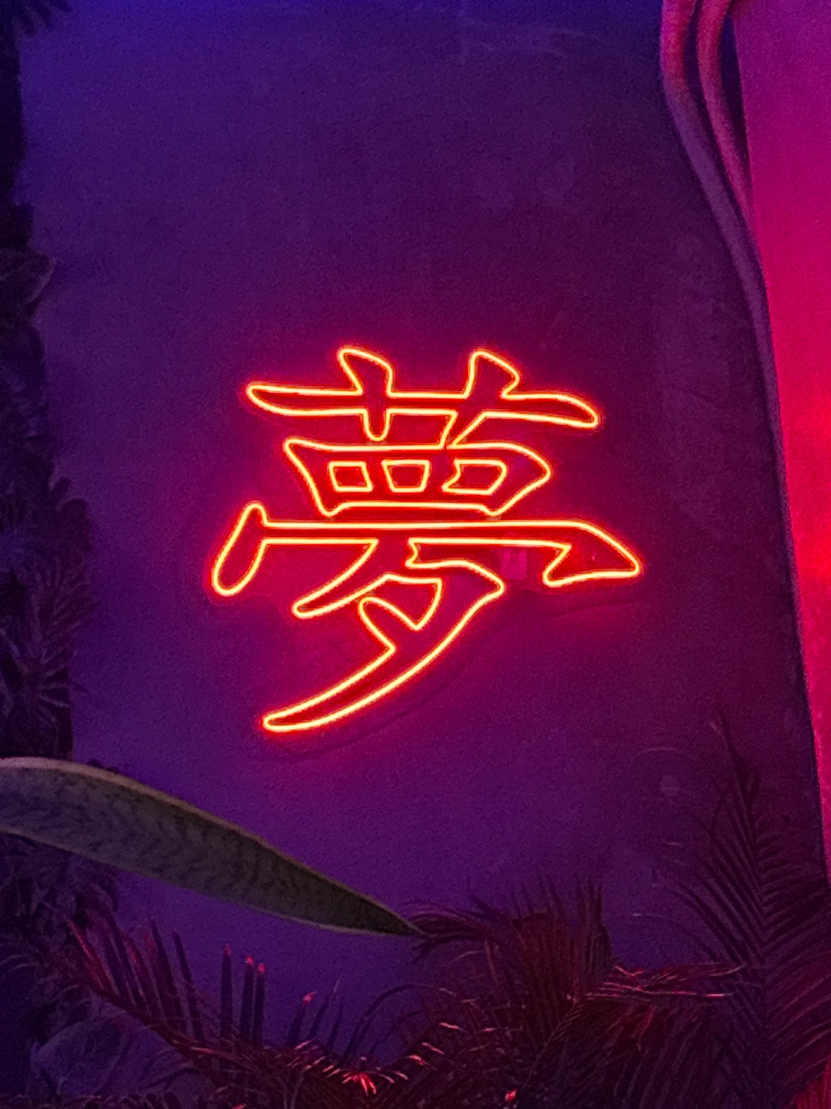 Interior of restaurant with neon signs documented in Kuta Selatan