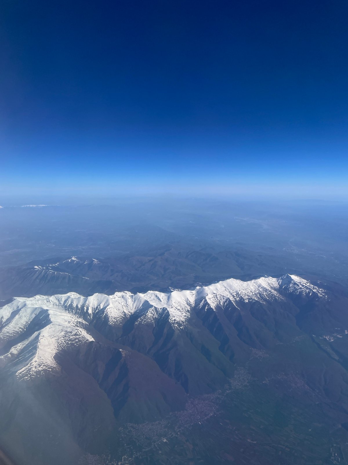 Morning aerial views capture Montenegro's snow-capped mountains and coastline