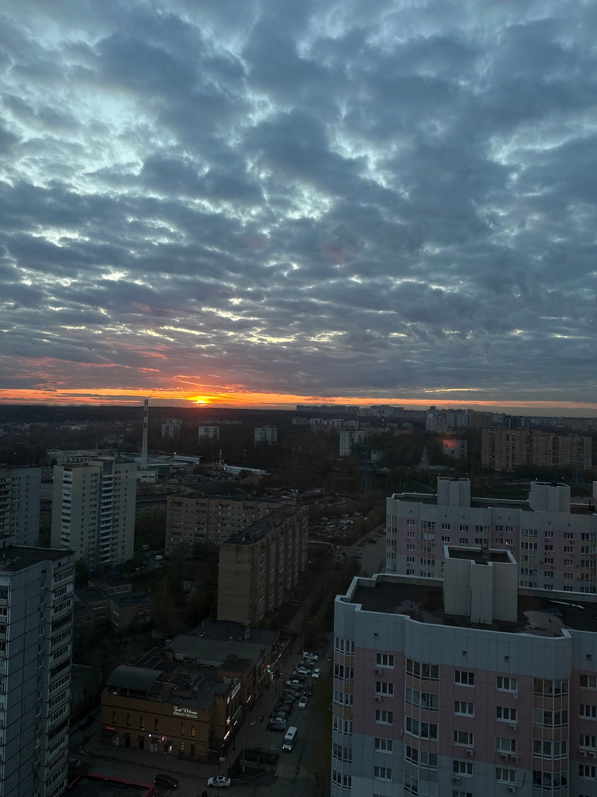 Dramatic sunset illuminates Khimki cityscape on May Day evening
