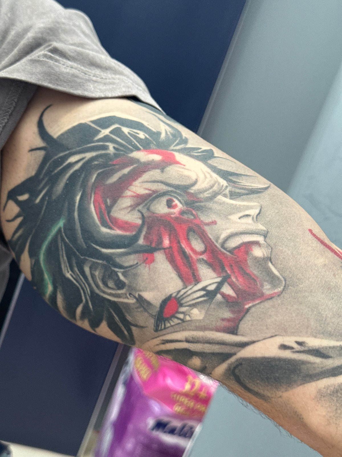 Tattooed individual spotted in Sofia displaying colorful artistic designs