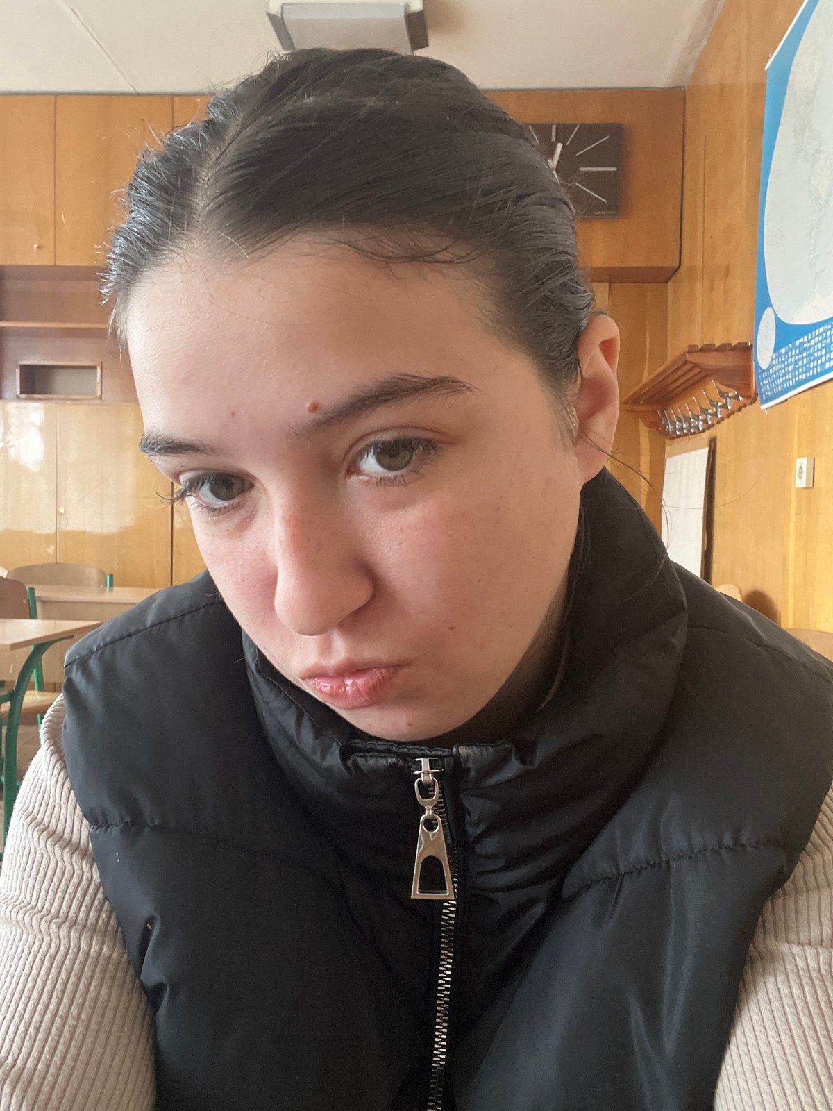 Woman photographed in Ukrainian classroom during morning hours