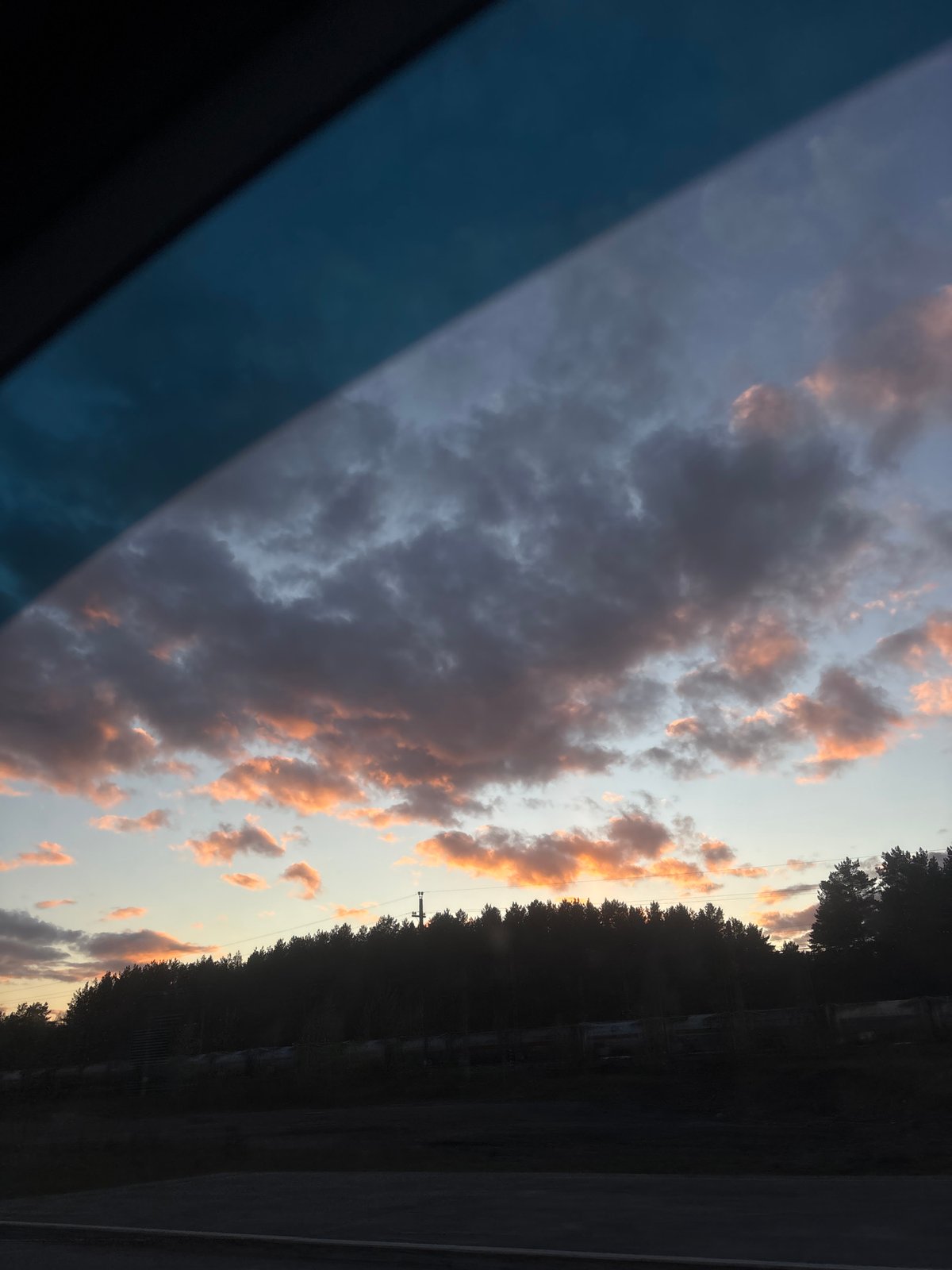Dusk sky photographed from vehicle interior in Perm, Russia