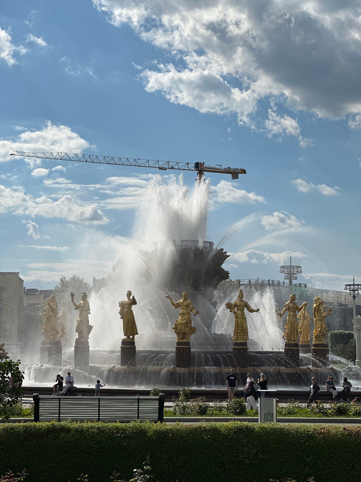 Visitor documents sunny afternoon at Moscow's VDNKh park