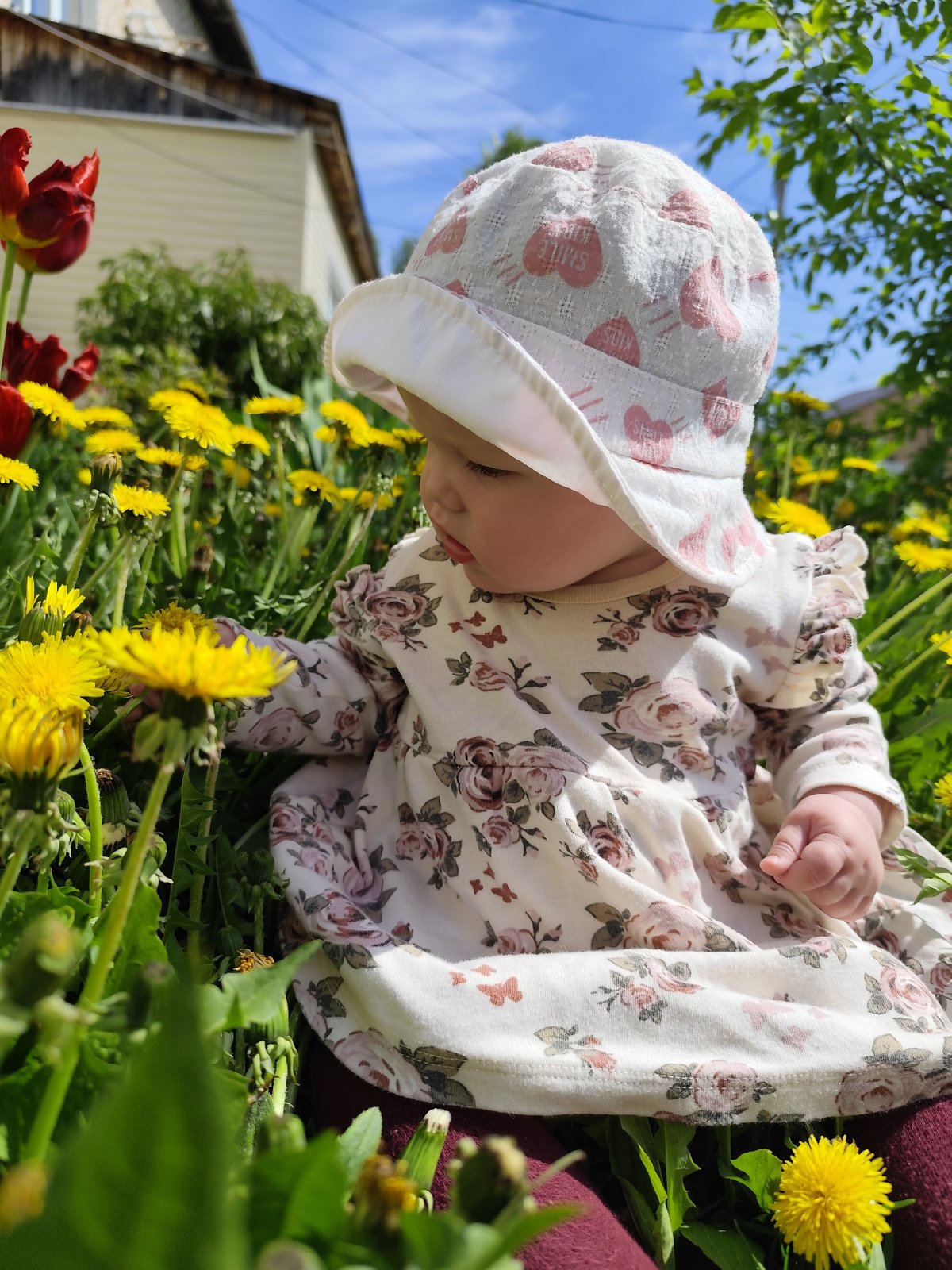 Mother and baby enjoy spring morning in Russian village