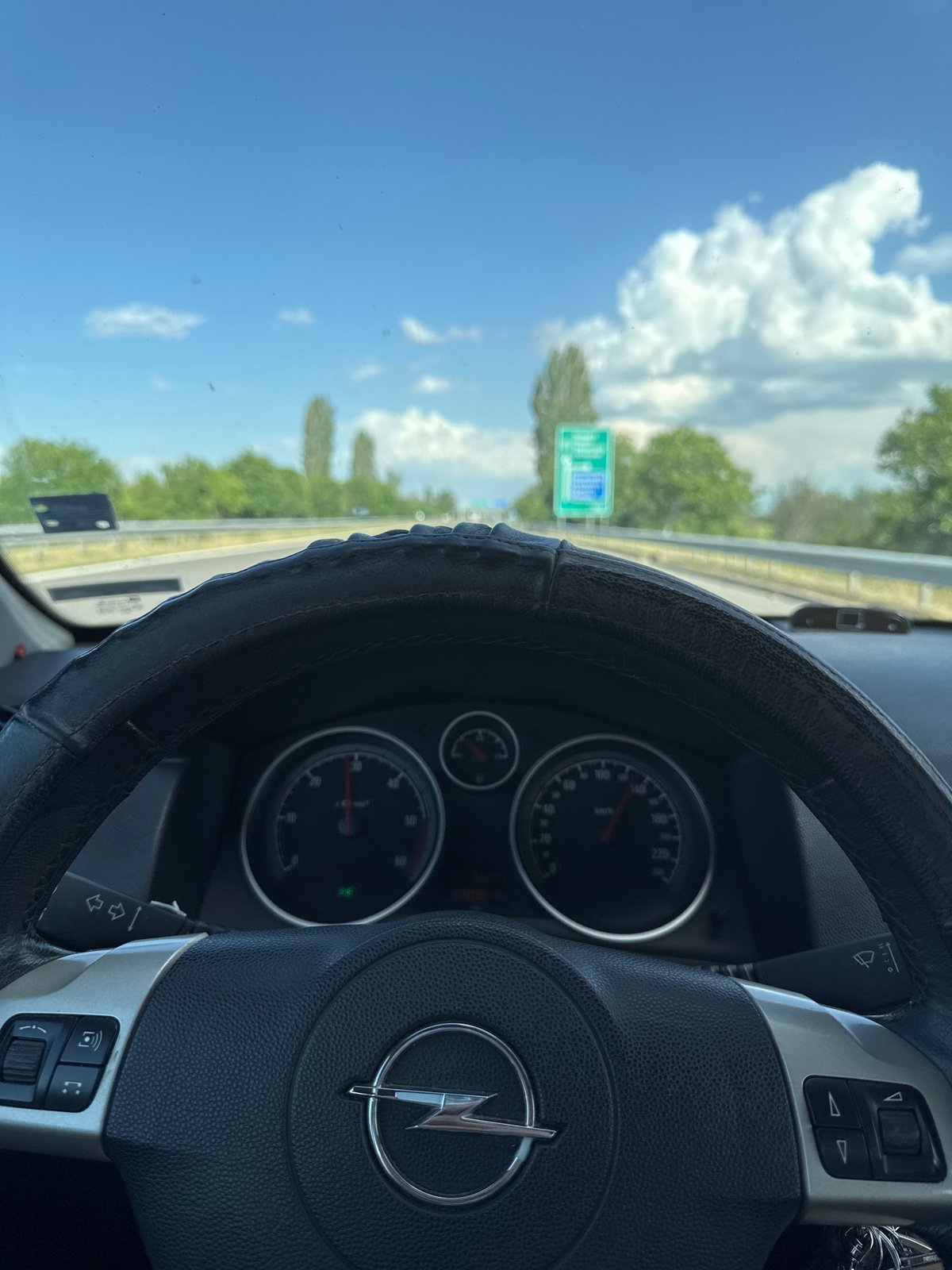 Driver documents Opel car interior during highway journey in Bulgaria