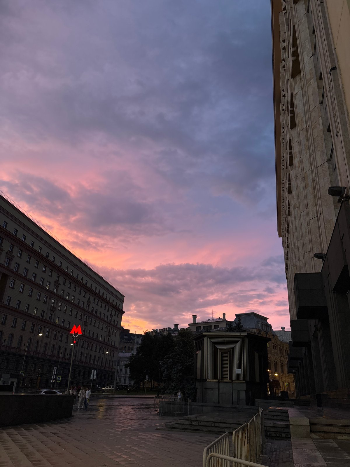Dusk at a metro stop, dramatic skies and street-level scenes