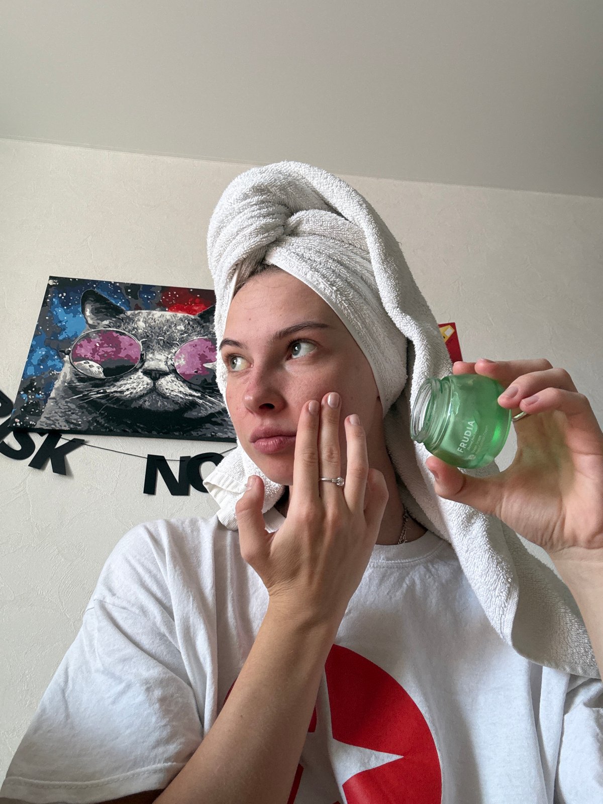 Woman's morning skincare routine documented in Perm, Russia