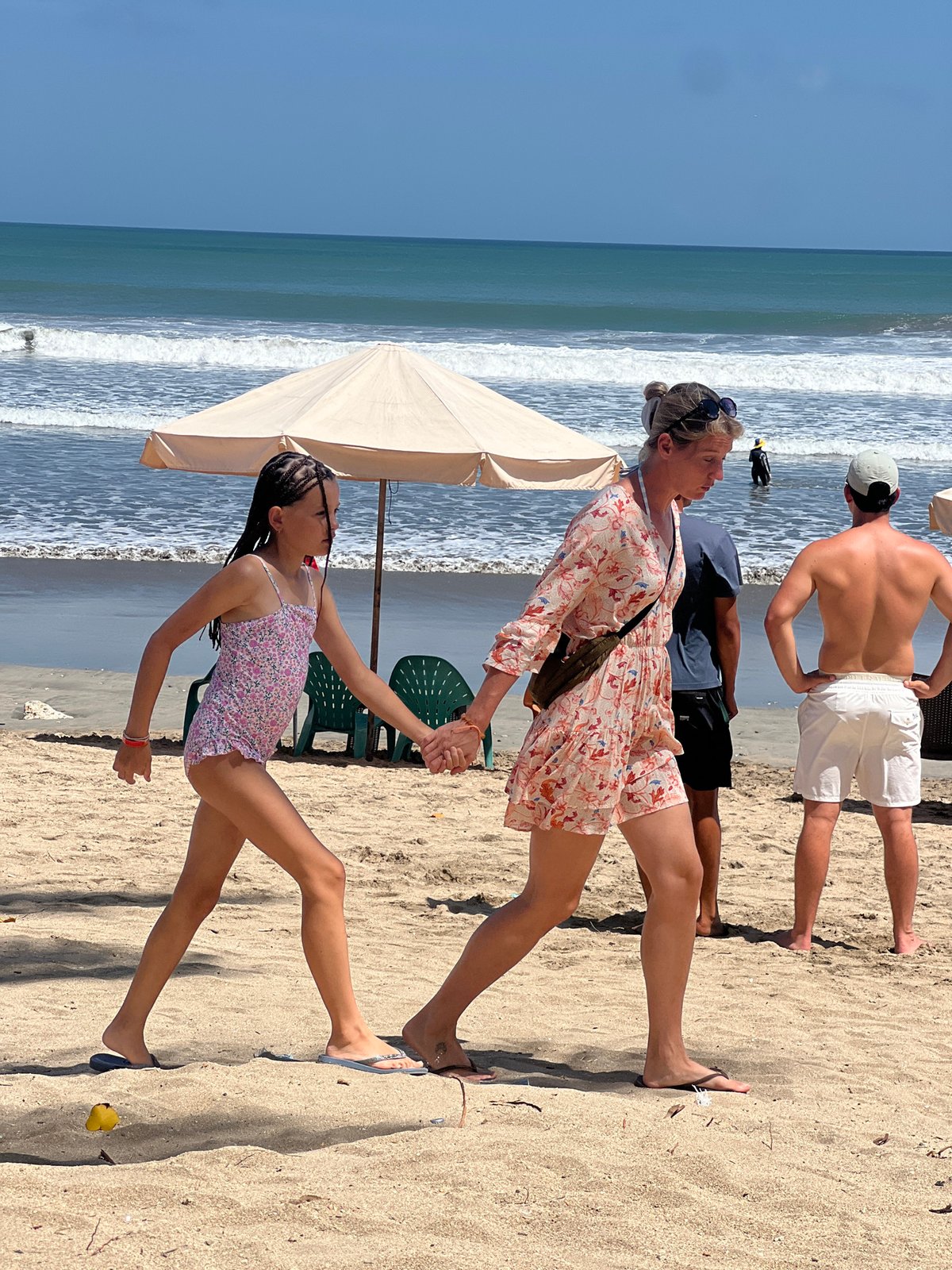 Busy morning at Kuta Beach: sun, surf, and sand life