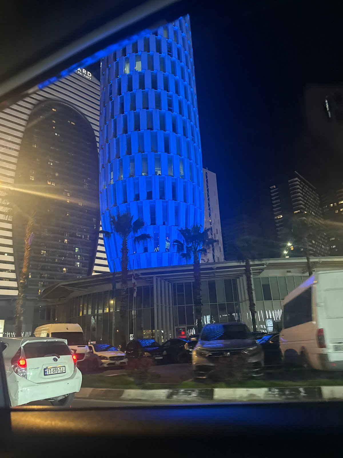 Nighttime urban skyline observed from vehicle in Batumi, Georgia