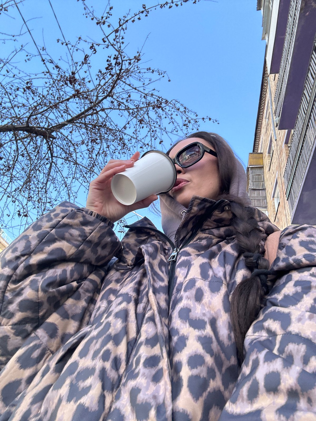 Woman enjoys morning coffee by Yenisey River in Krasnoyarsk