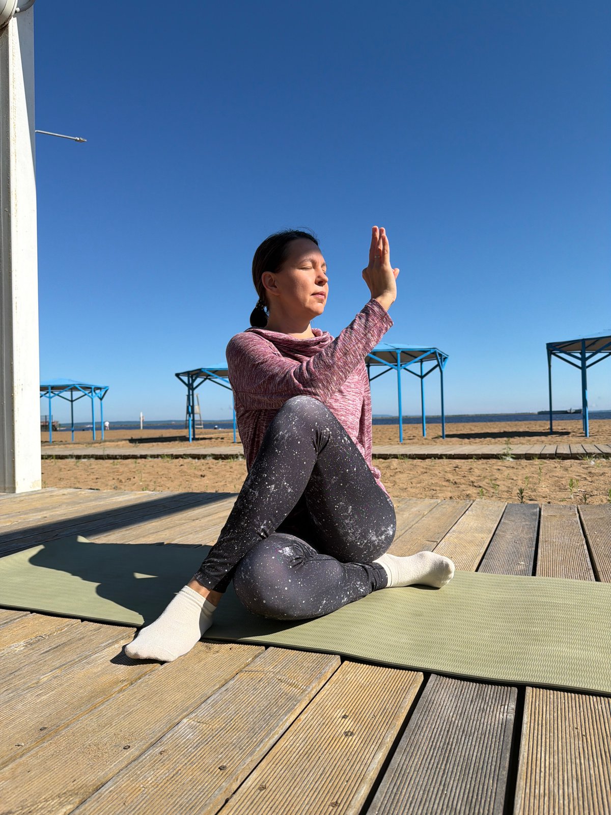 Early morning yoga session held on Chaikovsky waterfront deck