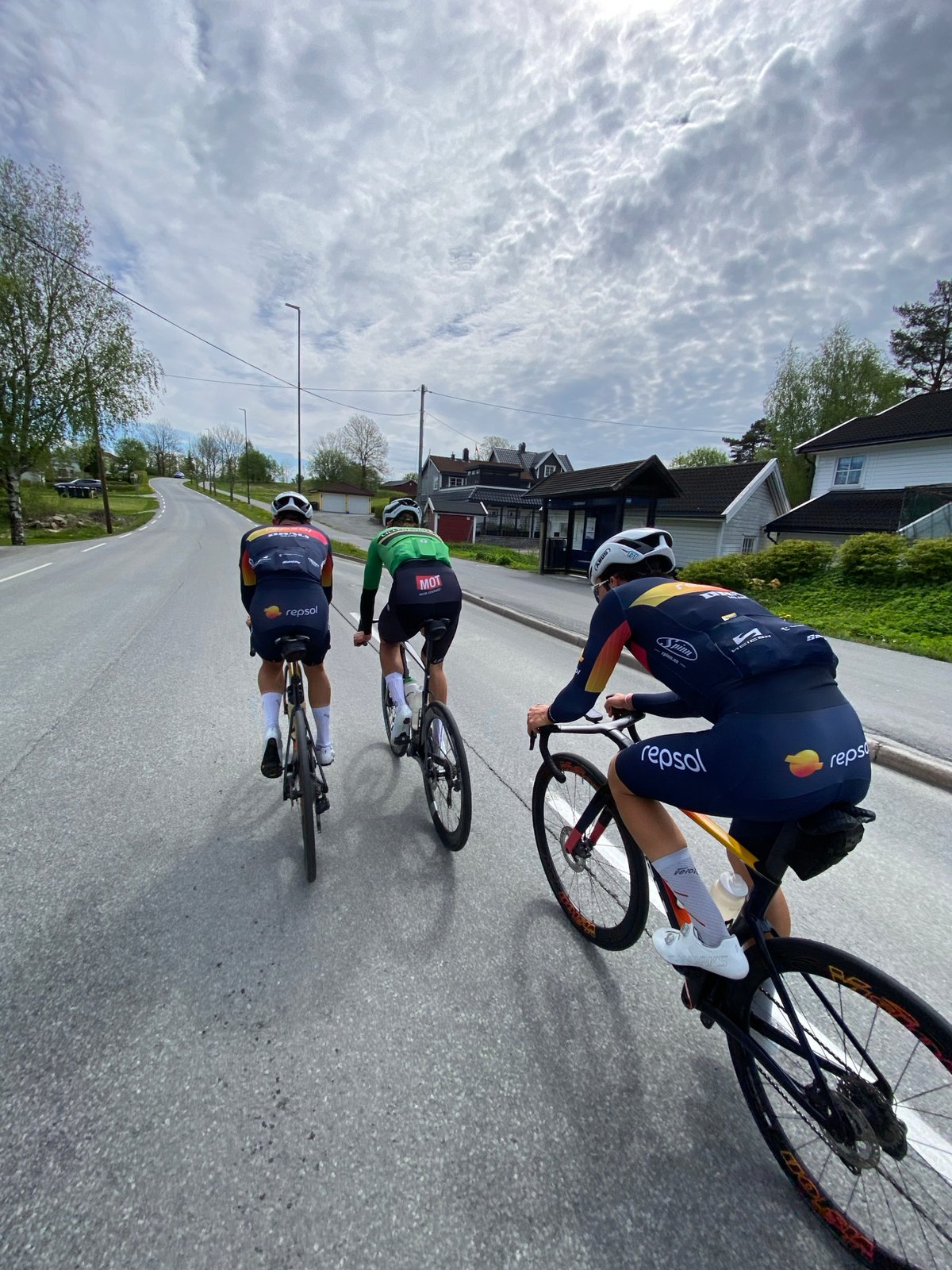 Three cyclists spotted on residential road in Heggedal, Norway