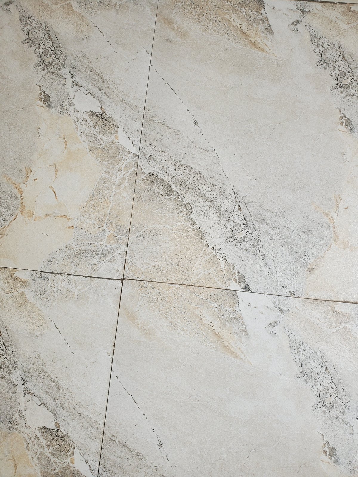 Witness documents marble-patterned tile surface installation