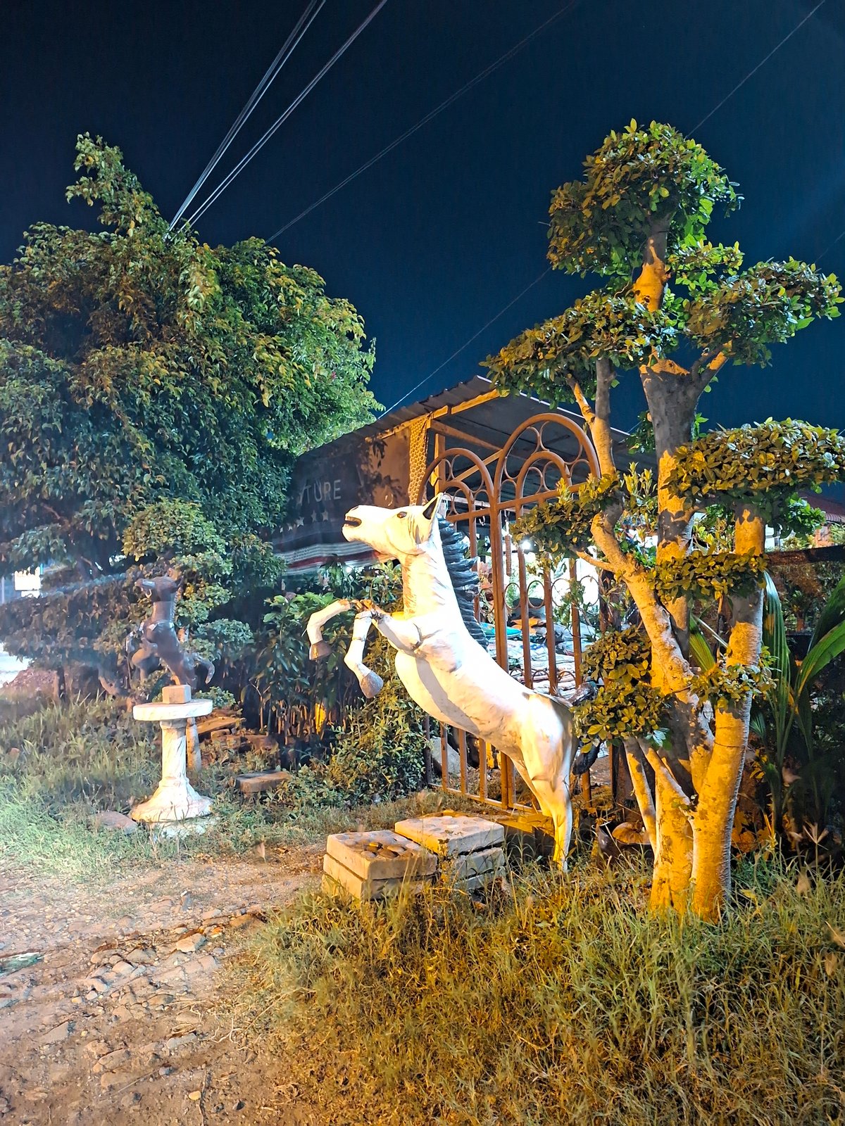 Nighttime statuary and infrastructure documented in Lhokseumawe, Indonesia