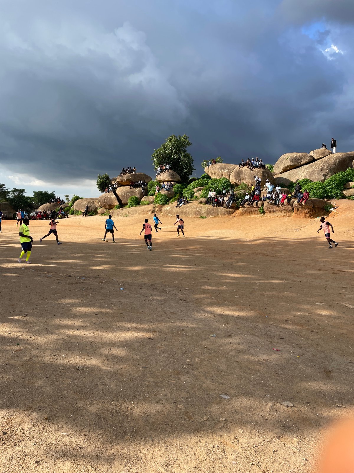 Football and granite boulders on the Jos Plateau