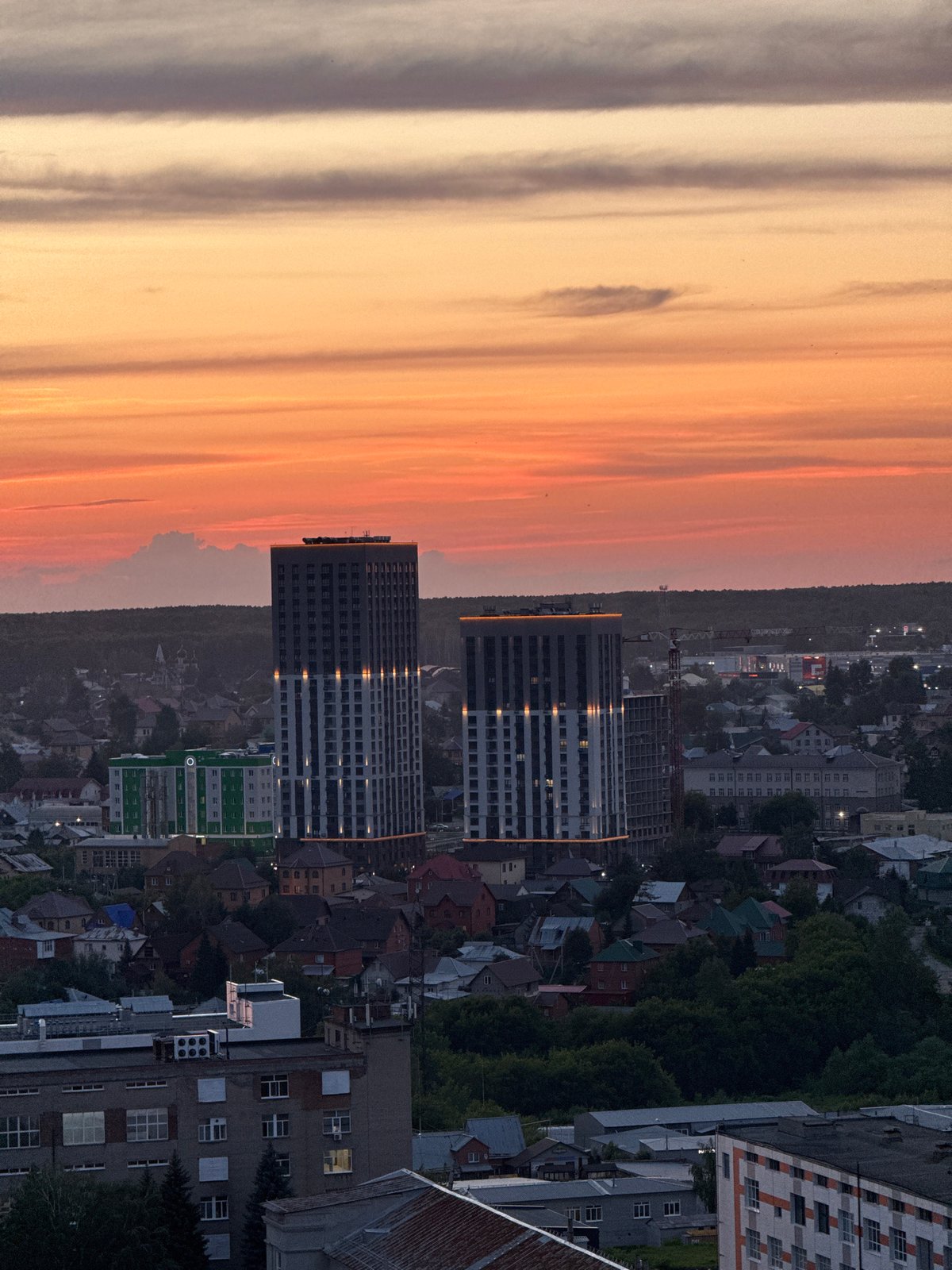 Novosibirsk skyline glows under a golden hour sky