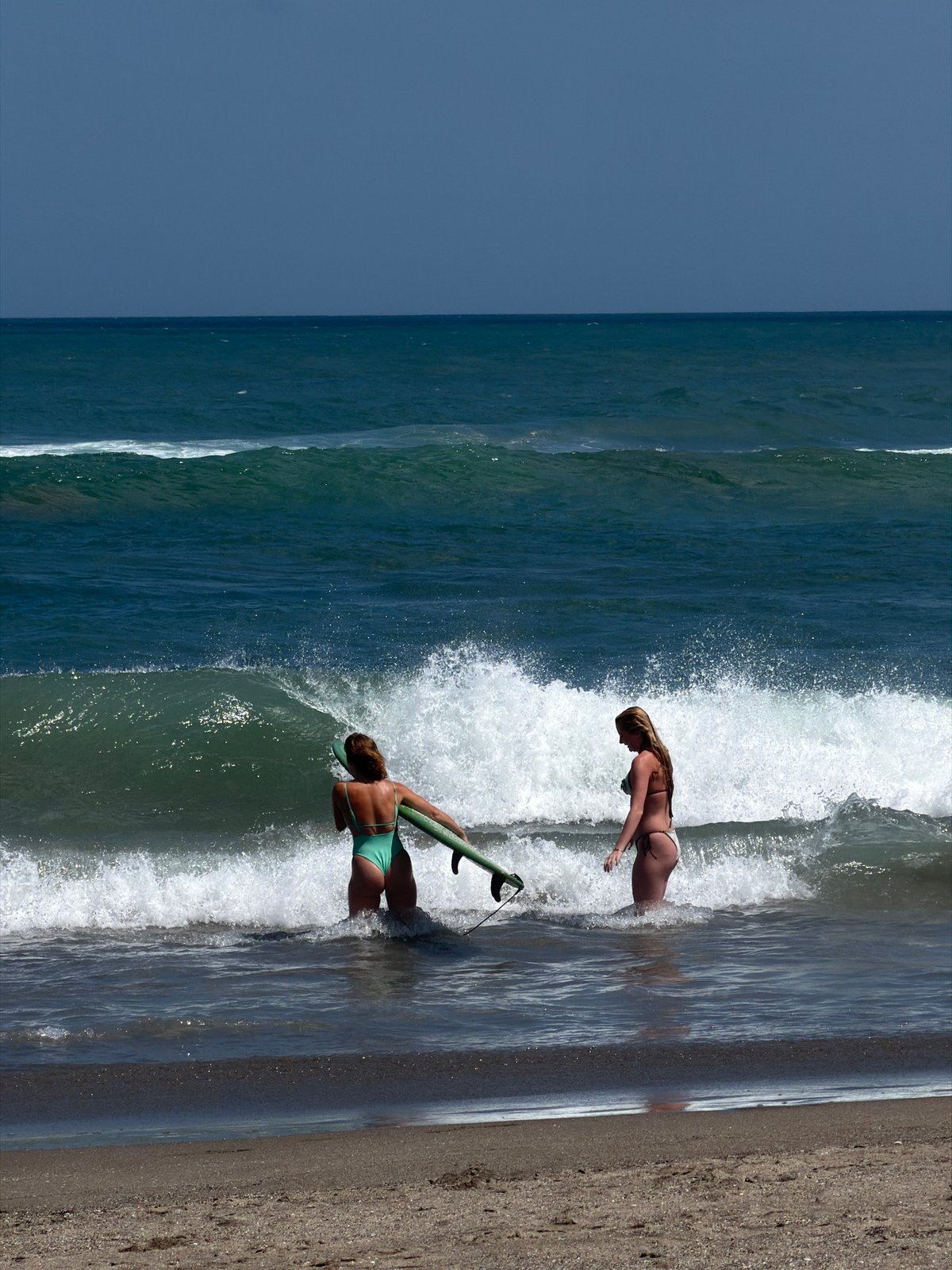 Morning beach scene in North Kuta — surfers, walkers, ocean vibes