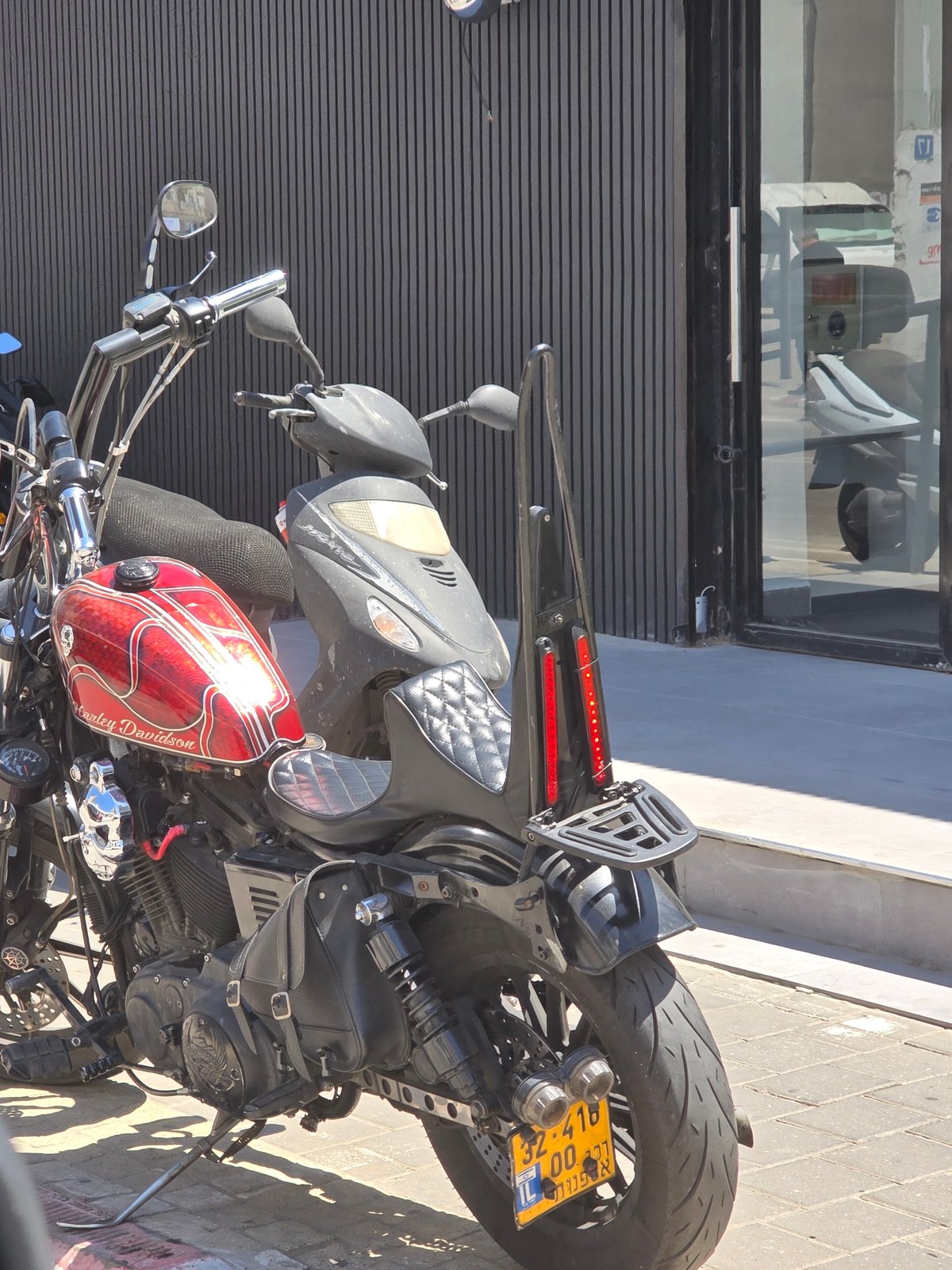 Two motorcycles parked on Tel Aviv sidewalk