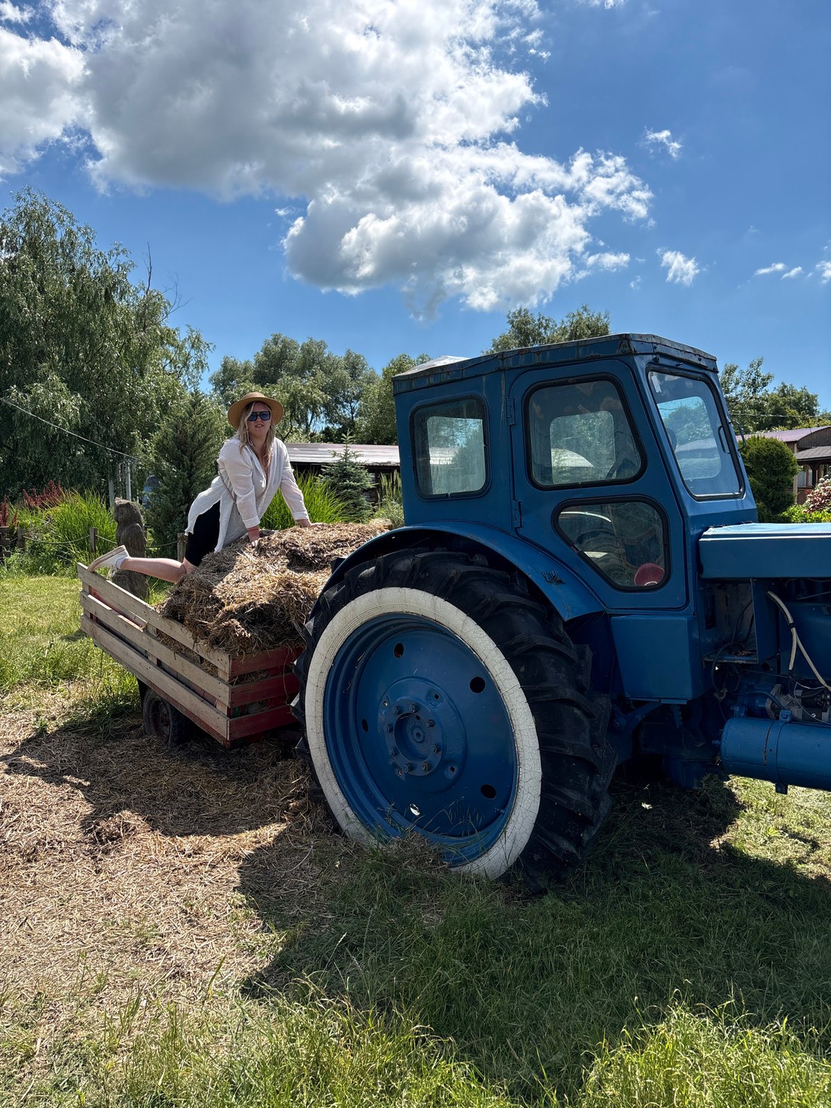 Woman visits emu farm in Gay-Kodzor, Russia on sunny day
