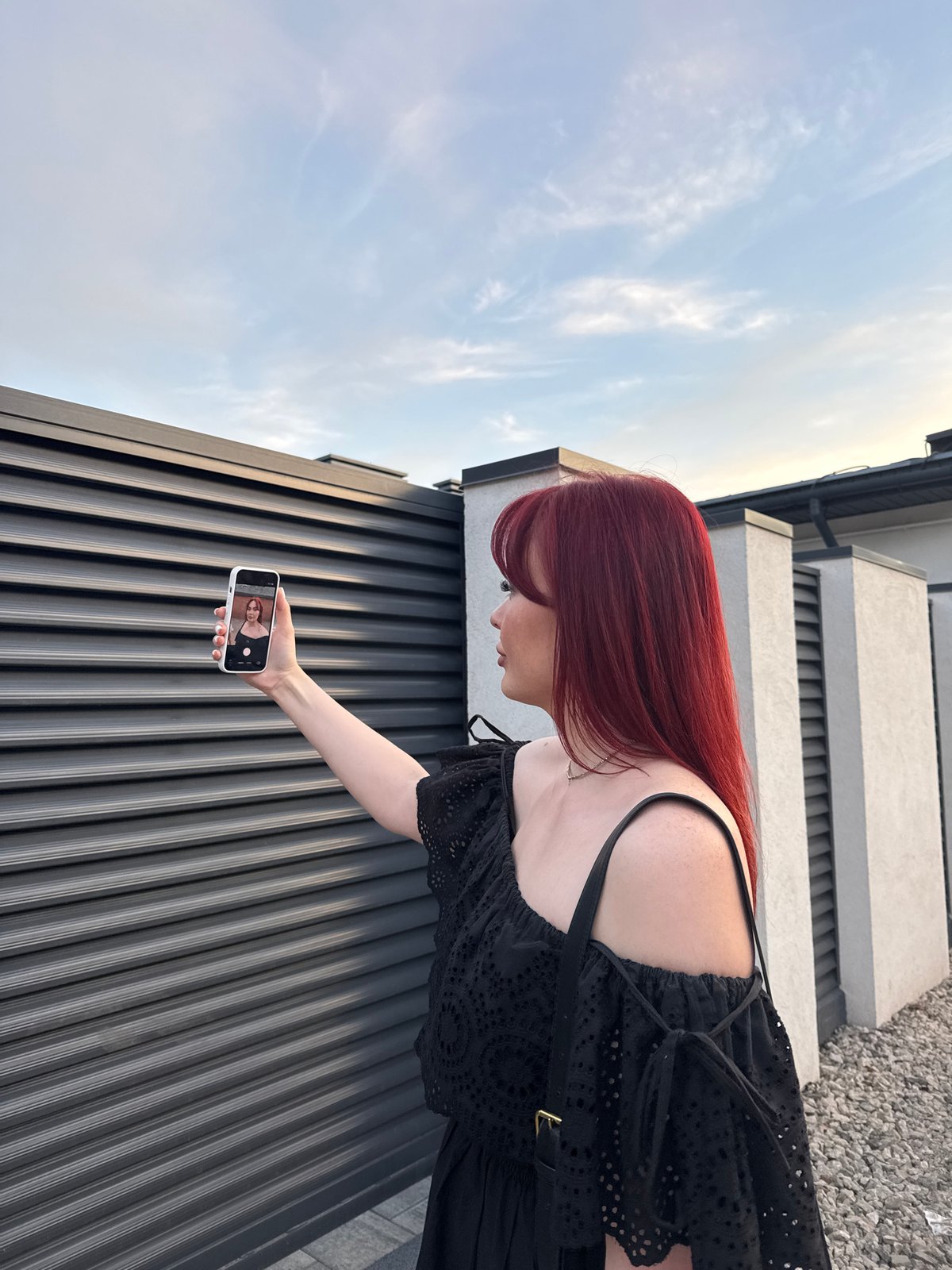 Women document casual park activities with phones and dogs