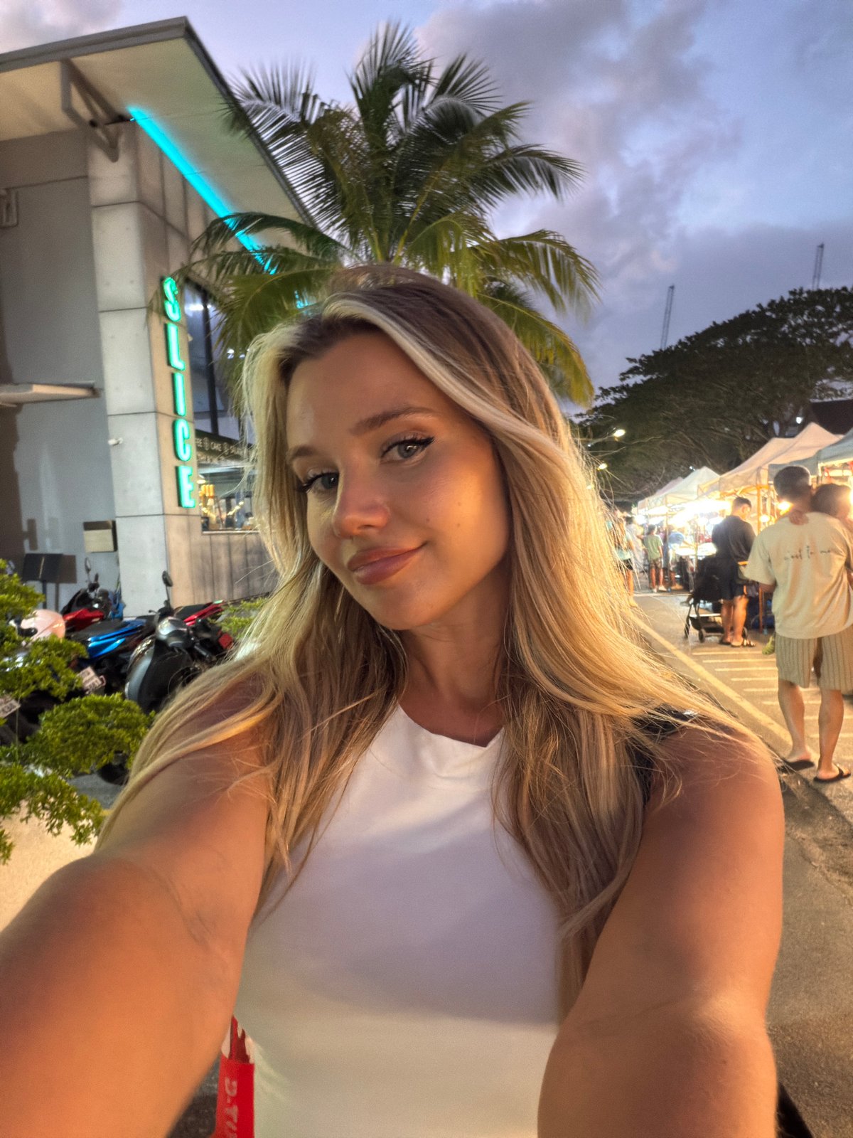 Selfie at a lit street market in Choeng Thale, Thailand