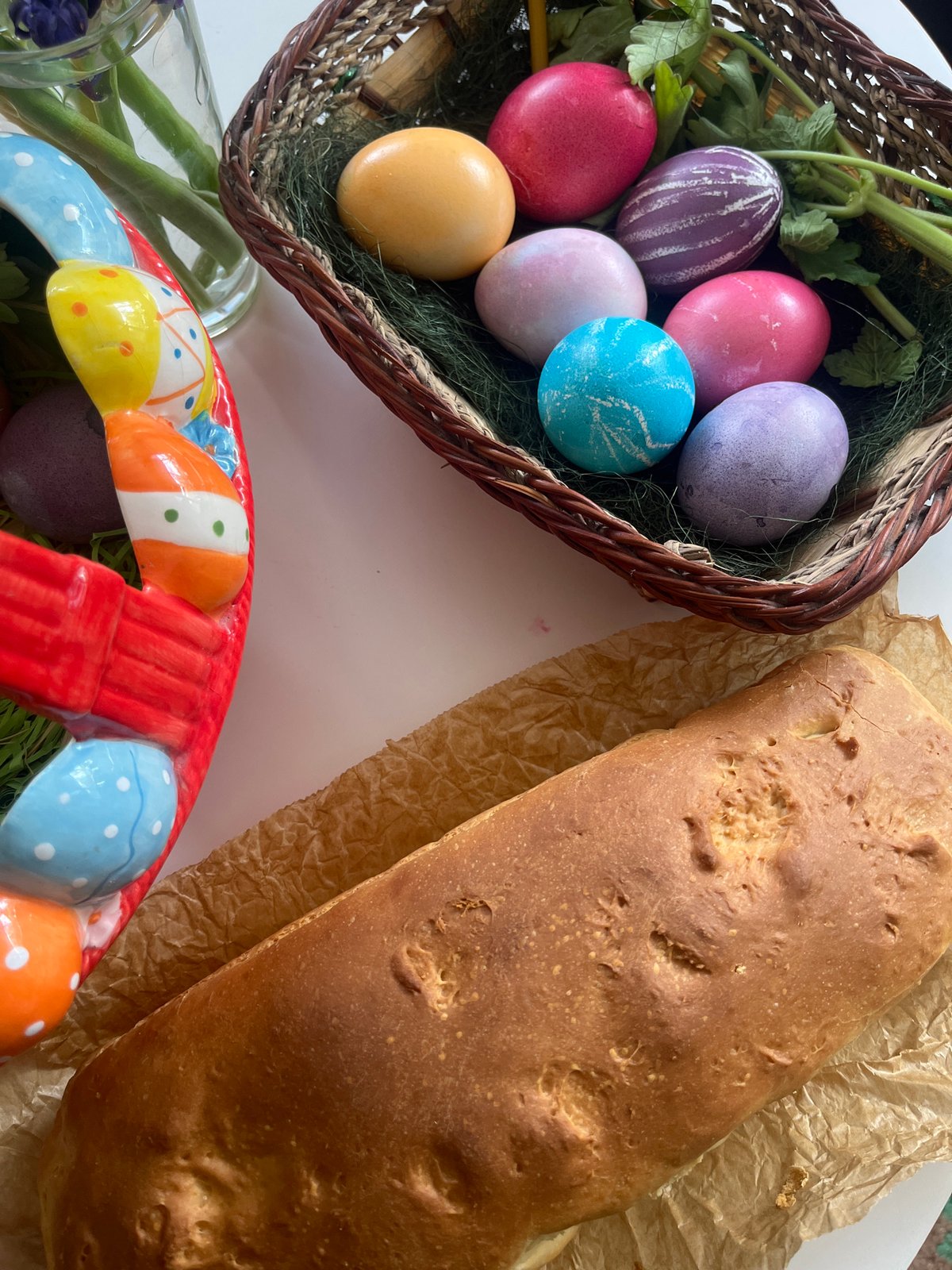 Easter celebration features decorated eggs and flower-topped cake