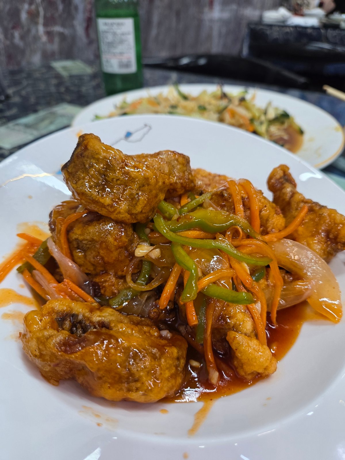 Restaurant meal featuring Asian dishes documented by witness