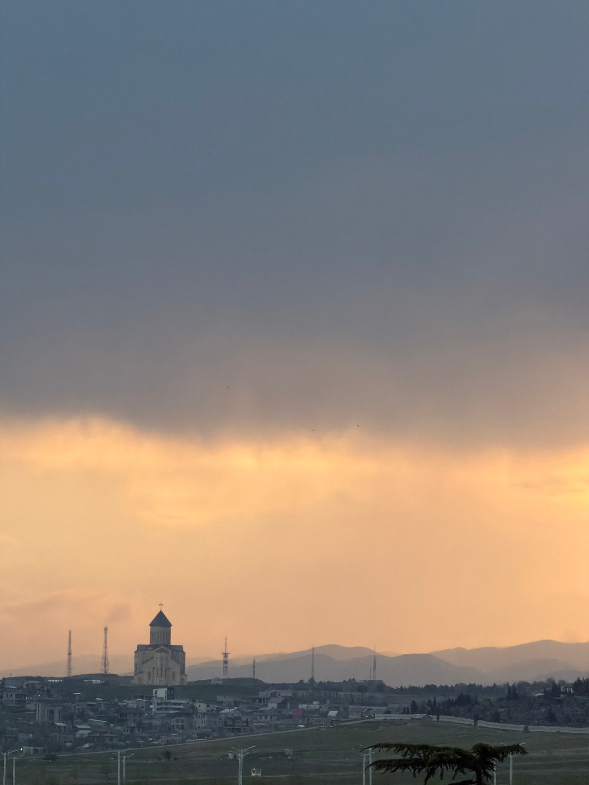 Dramatic divided sky photographed over Tbilisi during twilight
