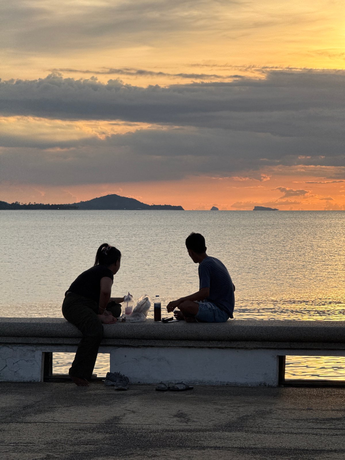 Thai coastal life: fishing boats, temples, and rooftop scenes