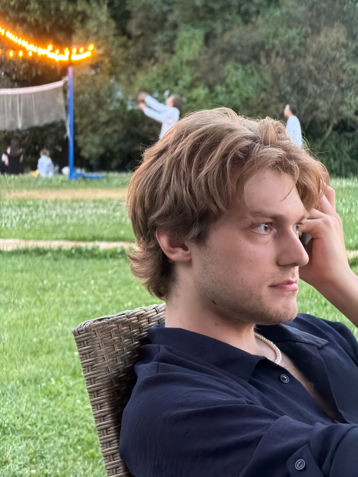 Laid-back Moscow park evening with games, lights, and crowds