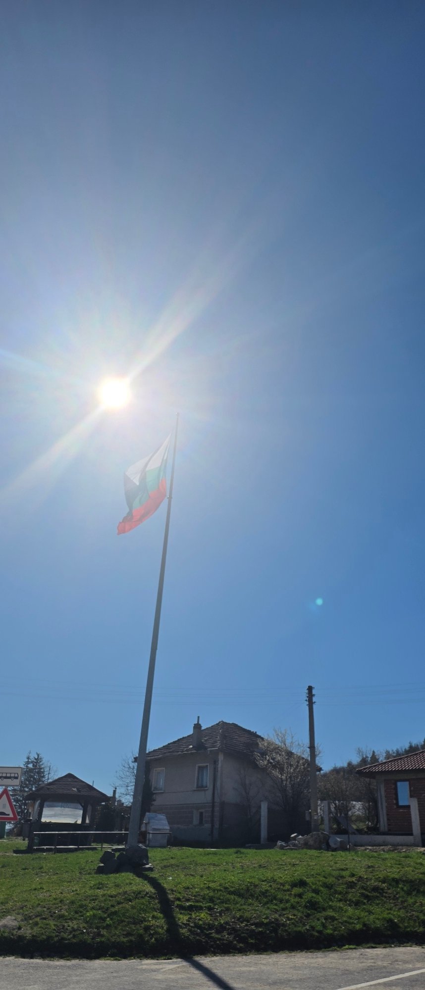 Morning scenes documented in Belchin Bulgaria including flag sculpture