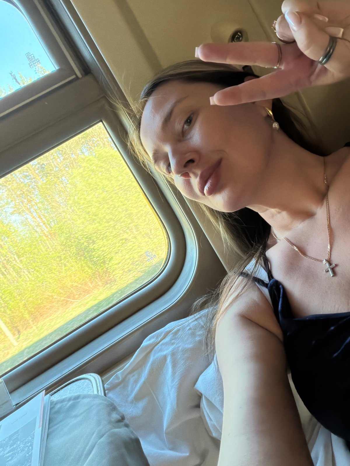 Woman photographs train journey through Russian countryside