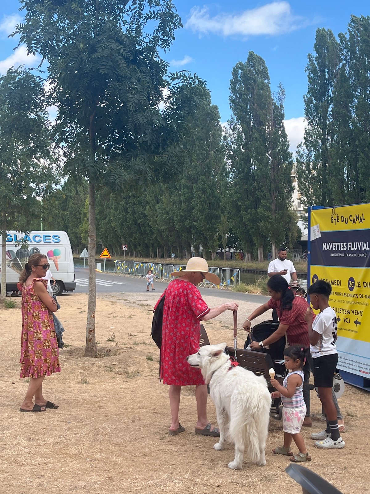 Community festival in Bobigny with giant pink elephant and canal activity