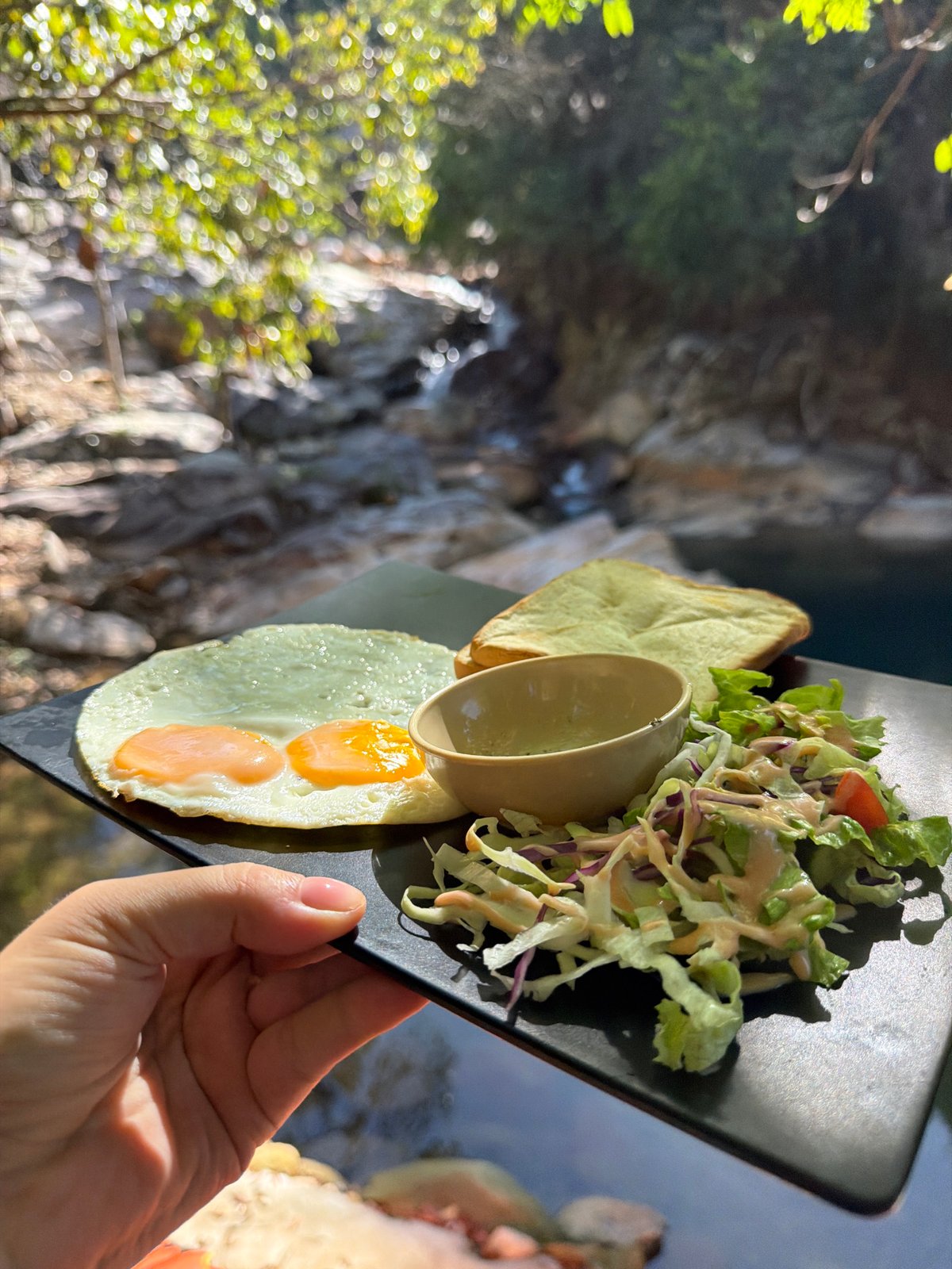 Jungle retreat near Huế with bridges, streams, and rustic lodging