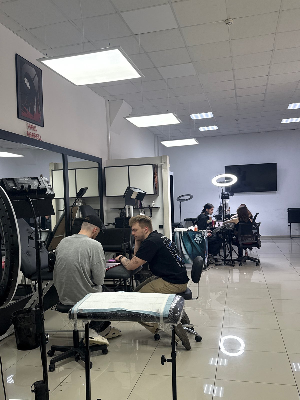Daily life captured across rainy Rostov-on-Don streets and tattoo studio