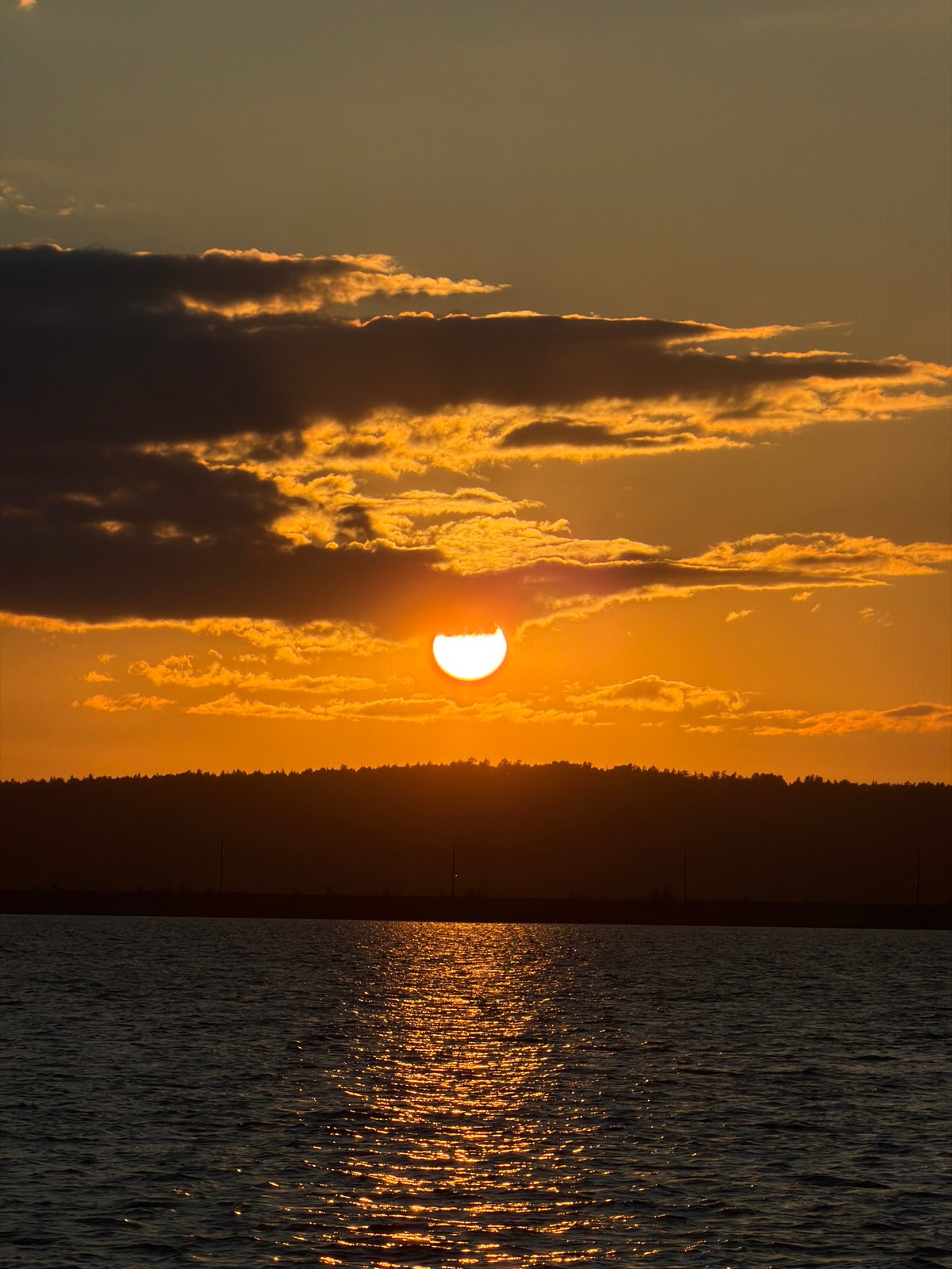 Sunset watcher enjoys quiet moment by Kama River