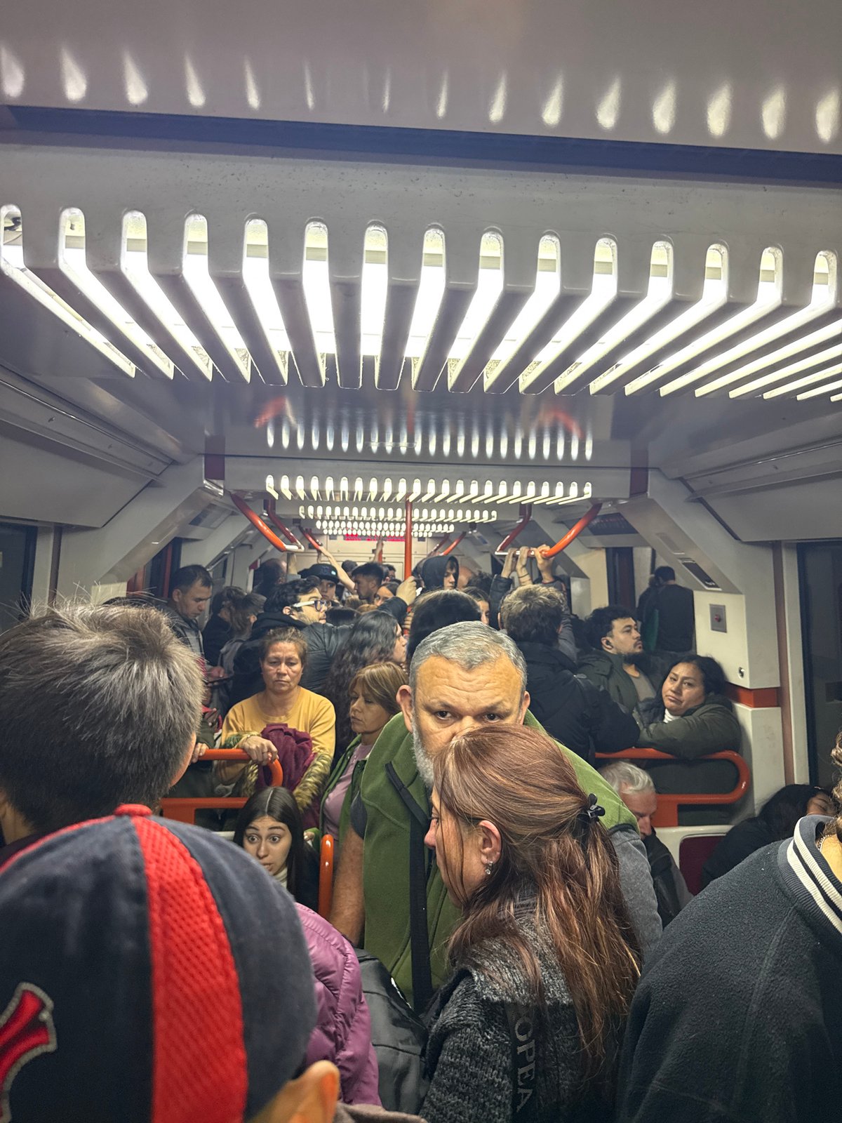 Packed subway car observed during evening rush in Buenos Aires