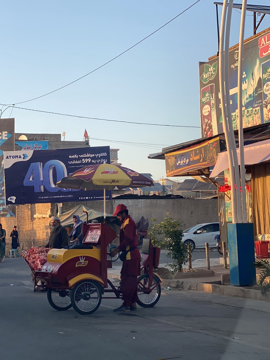 Busy street scene with wedding vehicles observed in Kandahar