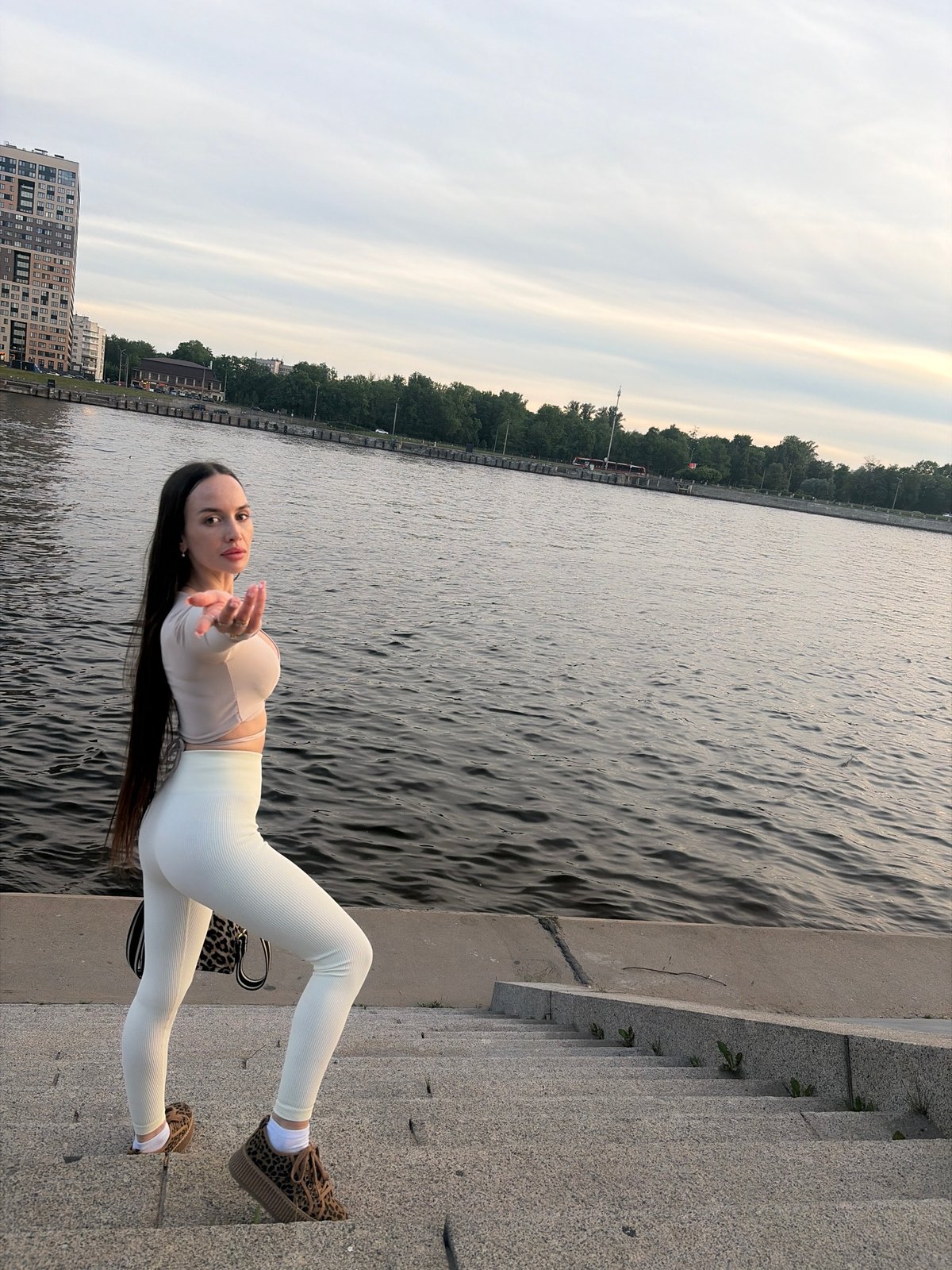 Evening riverfront scenes documented across Russian urban area